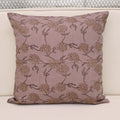 Pale ochre gold floral hand block print linen cushion cover on mauve background