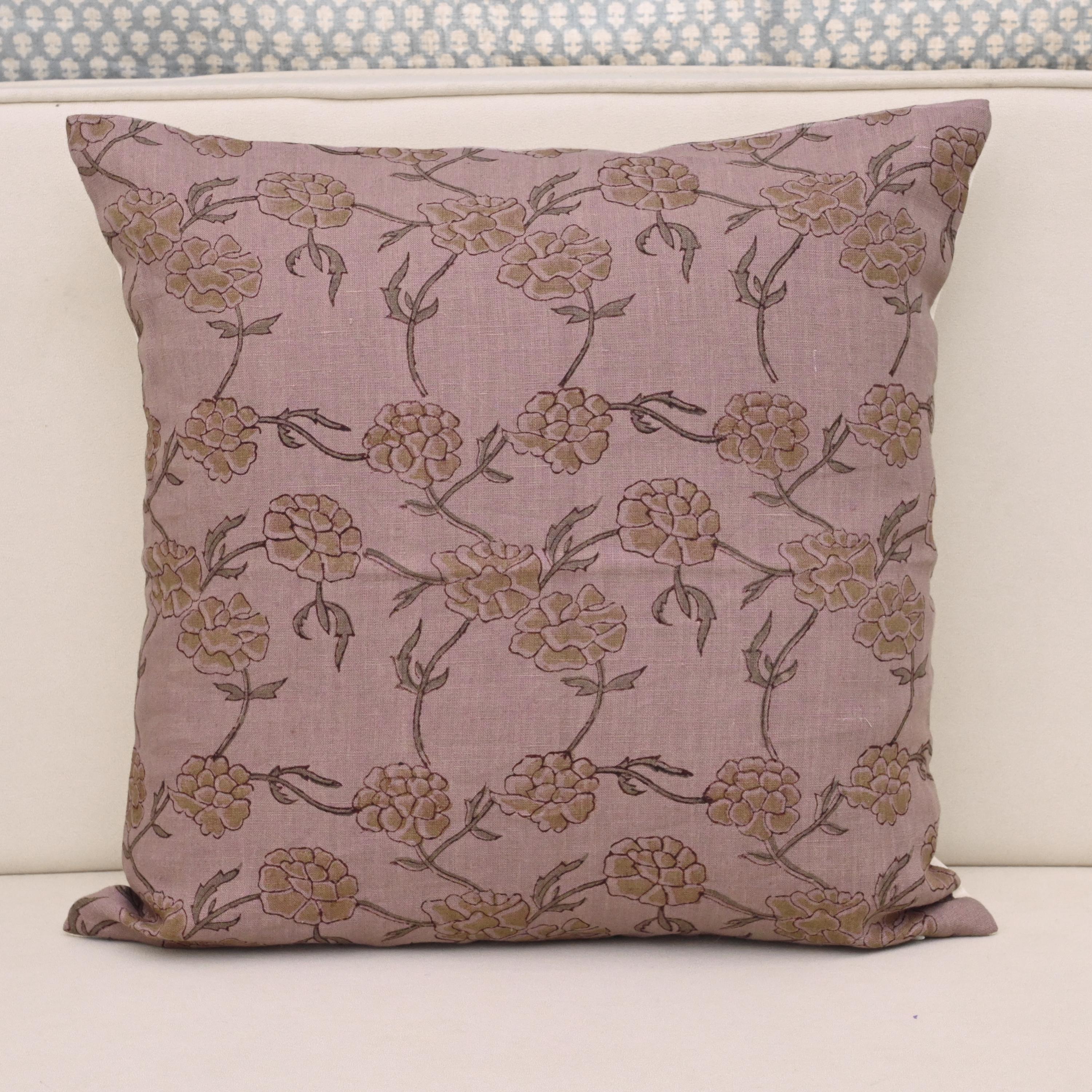 Pale ochre gold floral hand block print linen cushion cover on mauve background