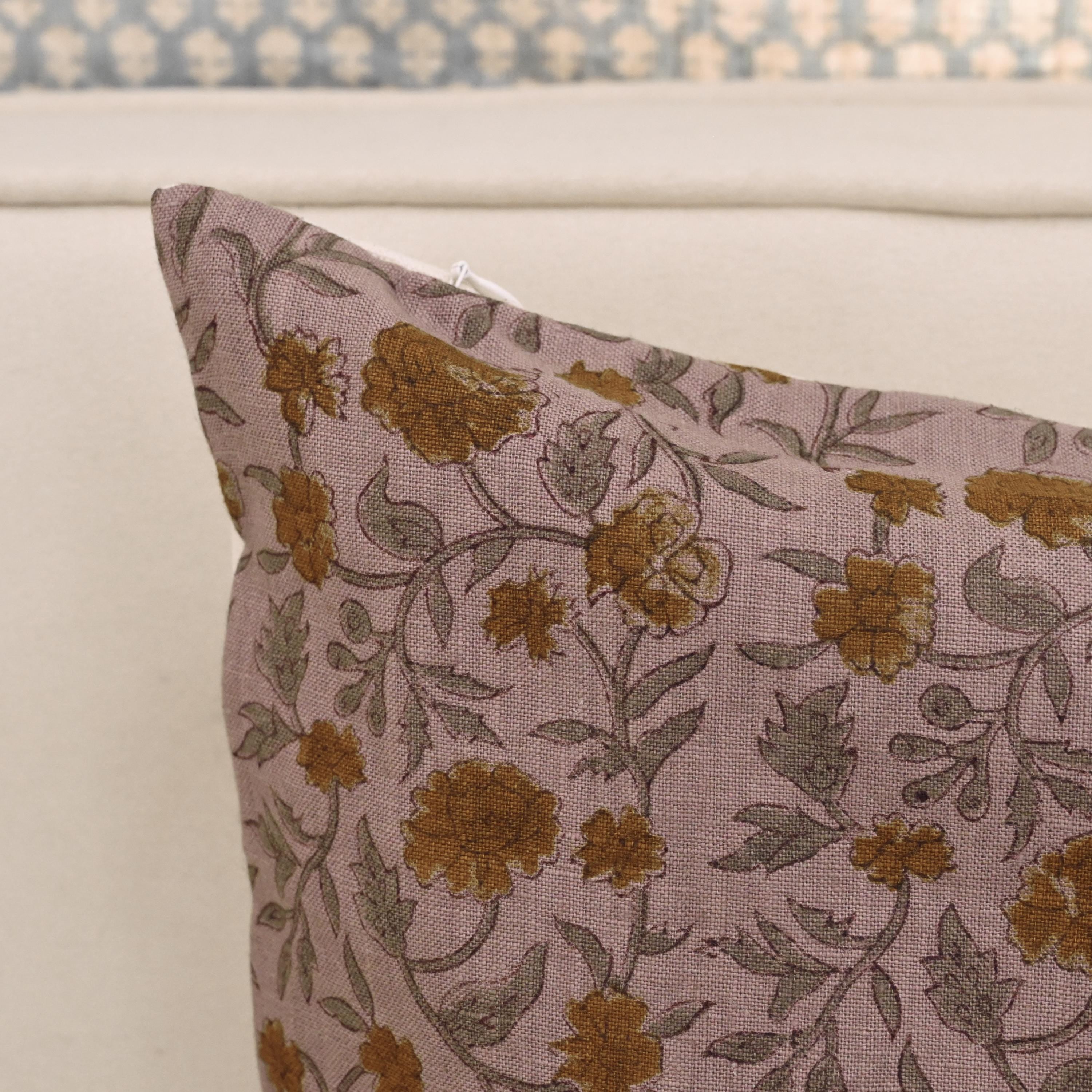 Rustic carnation trail linen pillow cover styled on a sofa