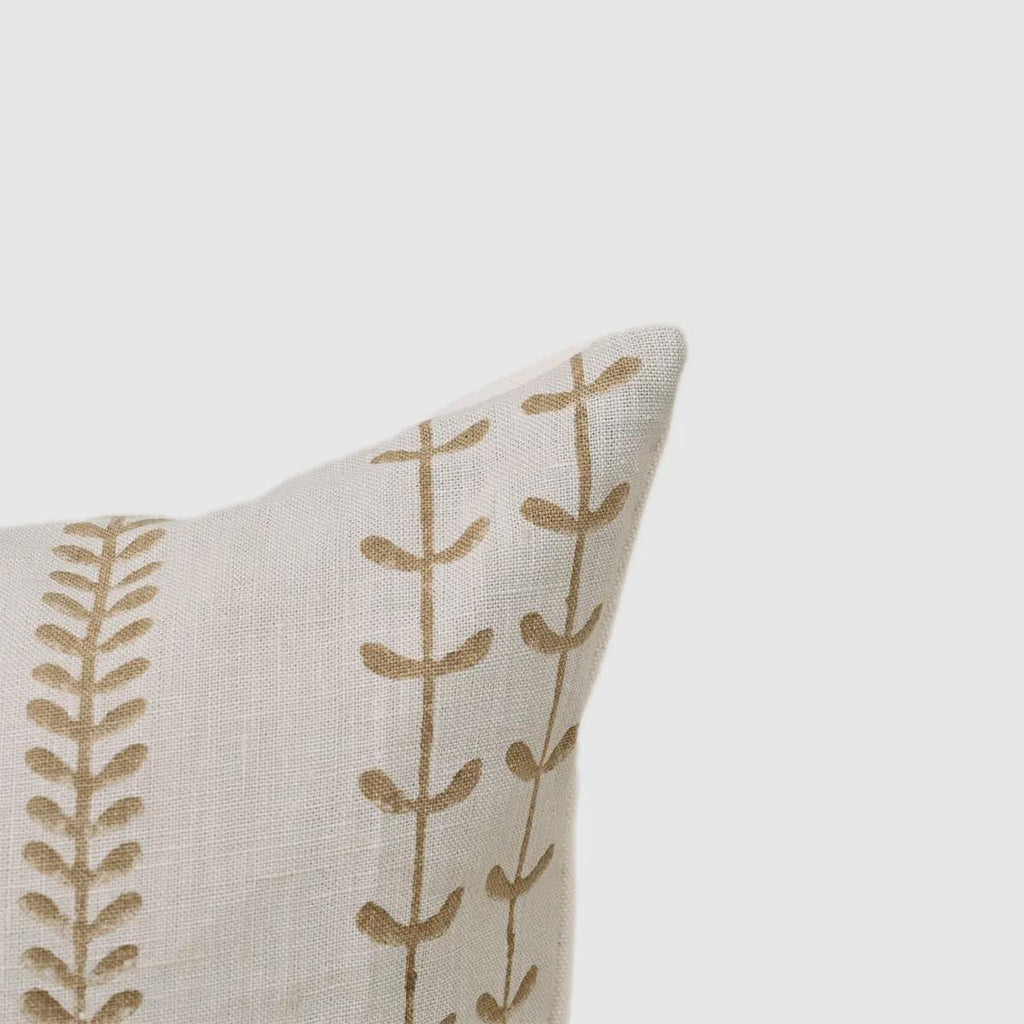 Close-up of olive leaf trail print on ivory linen