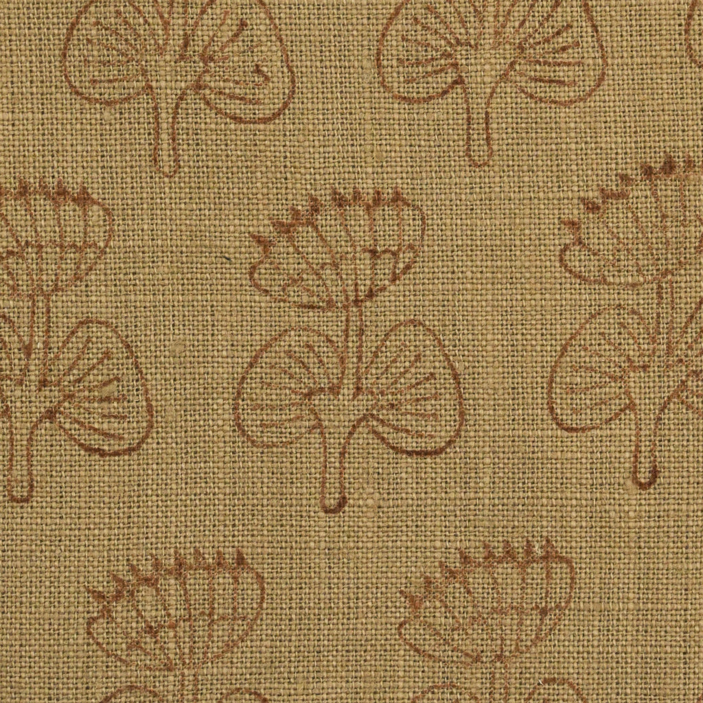 Close-up of the geometric leaf block print detail on camel linen