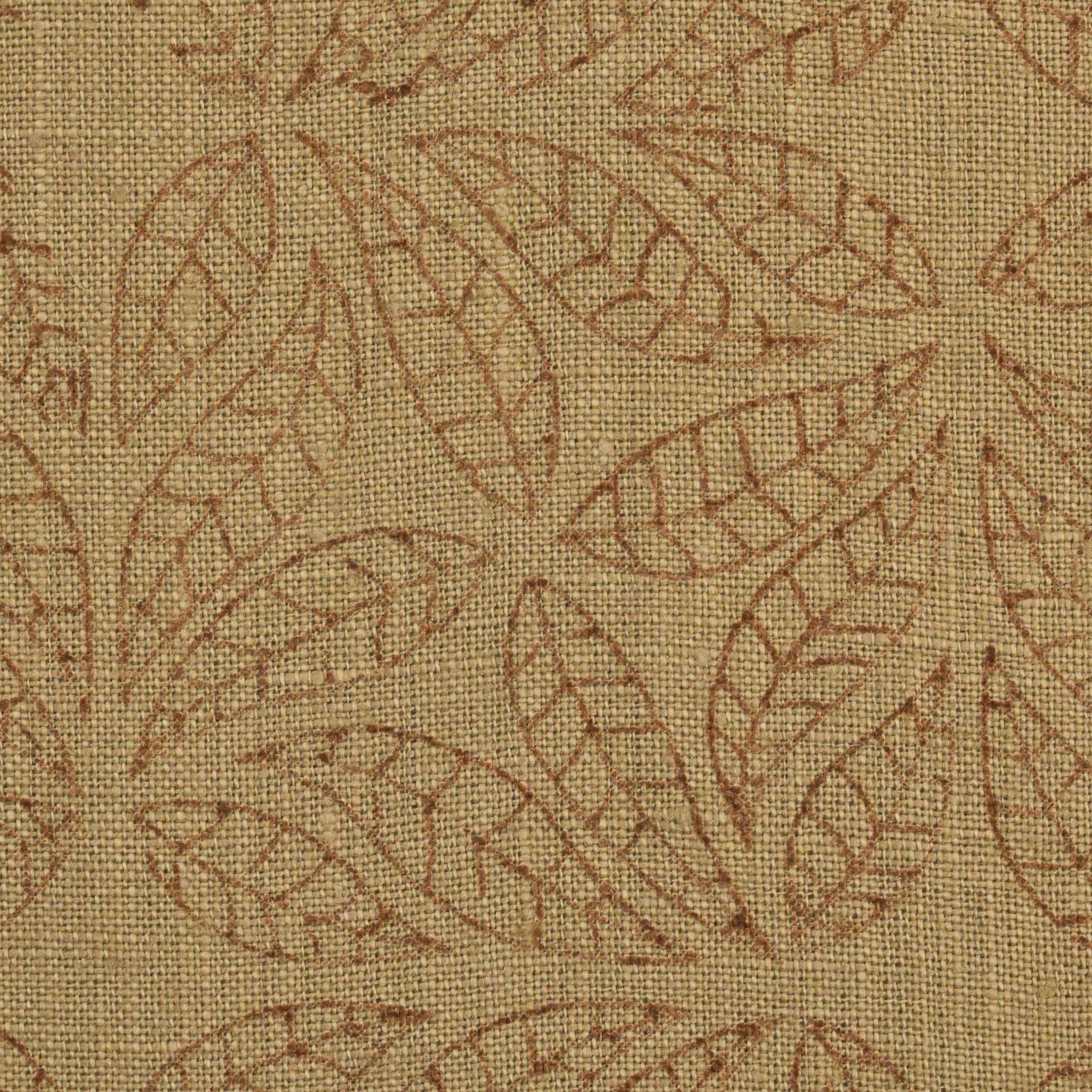 Close-up of the geometric leaf mandala block print detail on camel linen