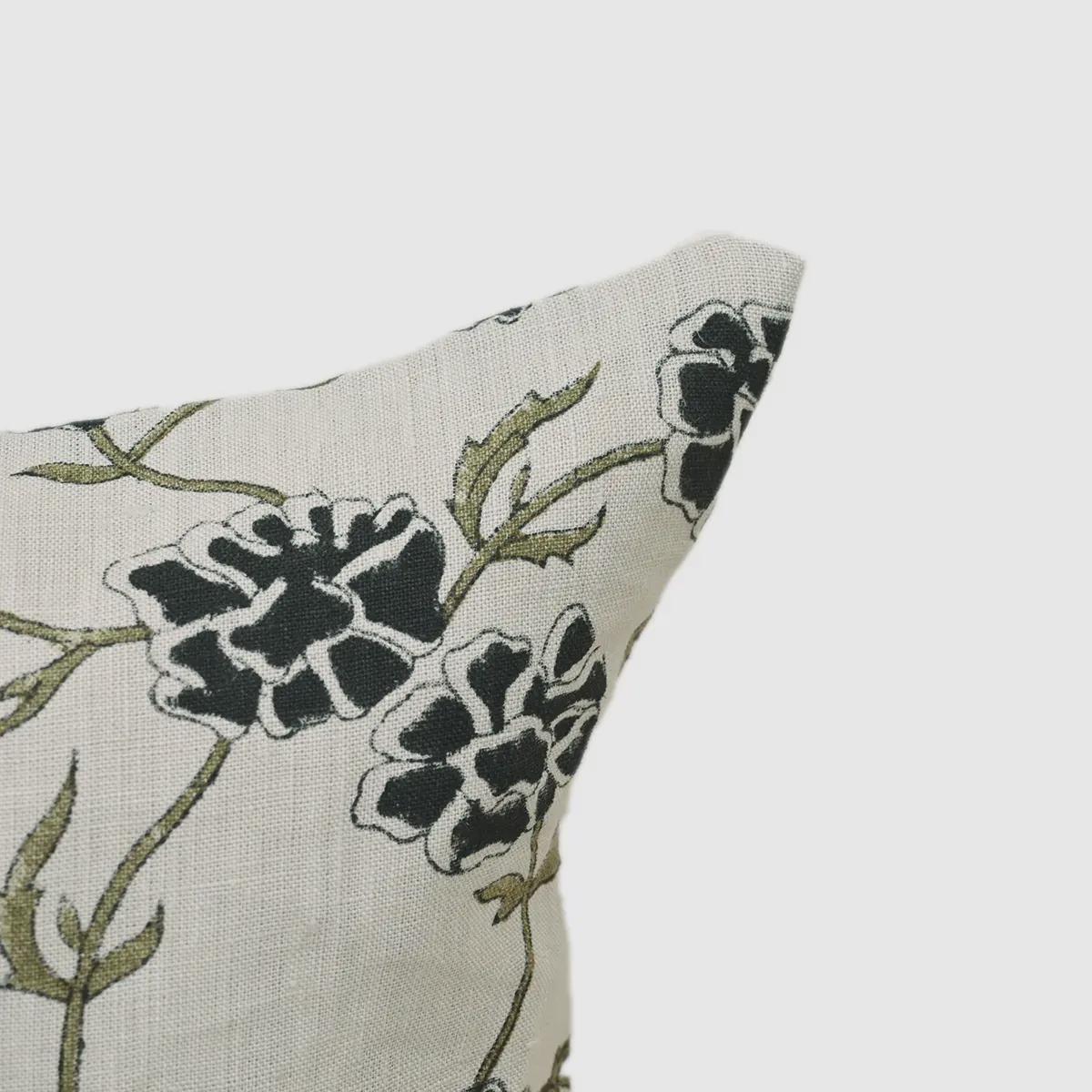 Charcoal floral linen pillow cover styled on a sofa
