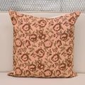 Blush pink rose floral hand block print linen pillow cover styled on a sofa
