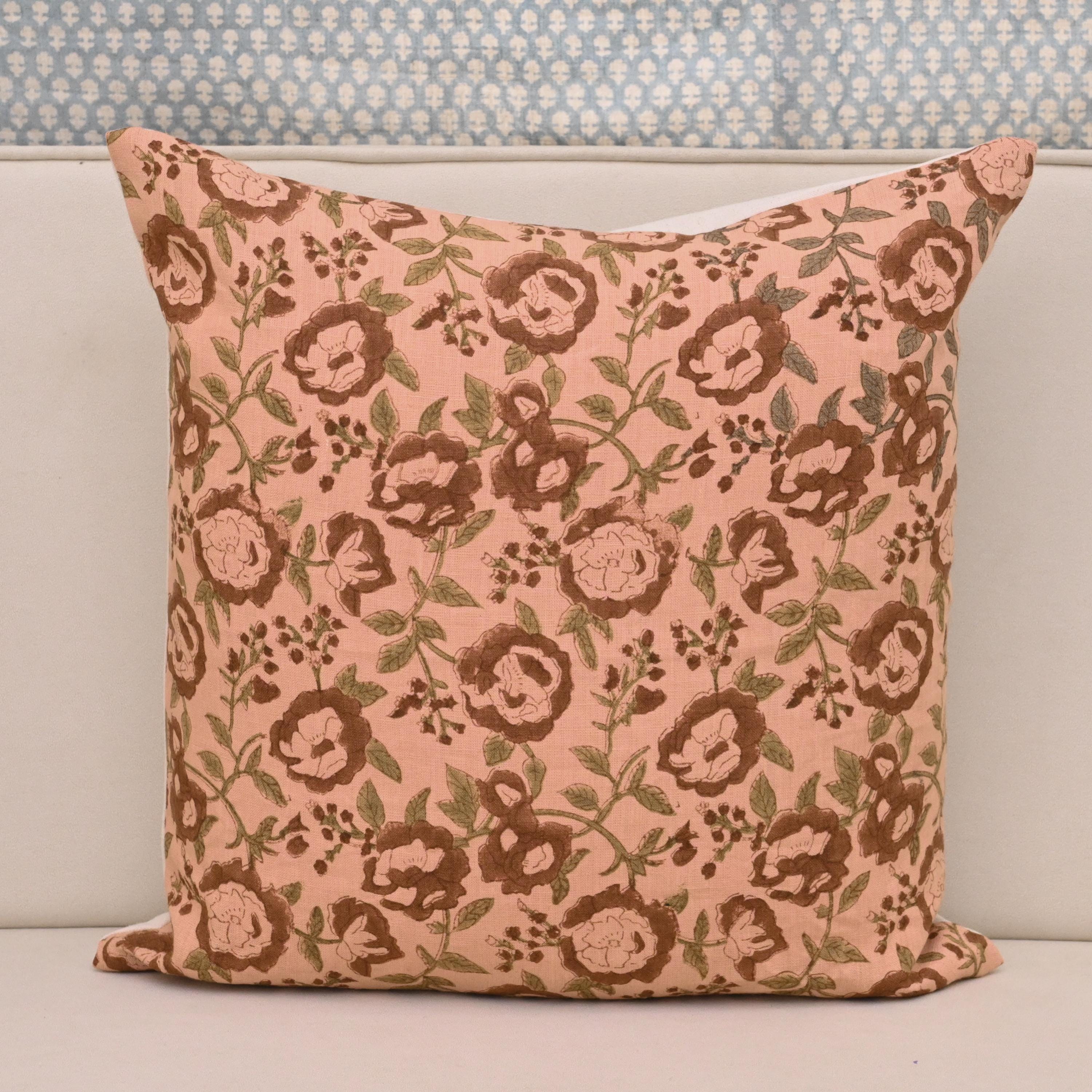 Blush pink rose floral hand block print linen pillow cover styled on a sofa