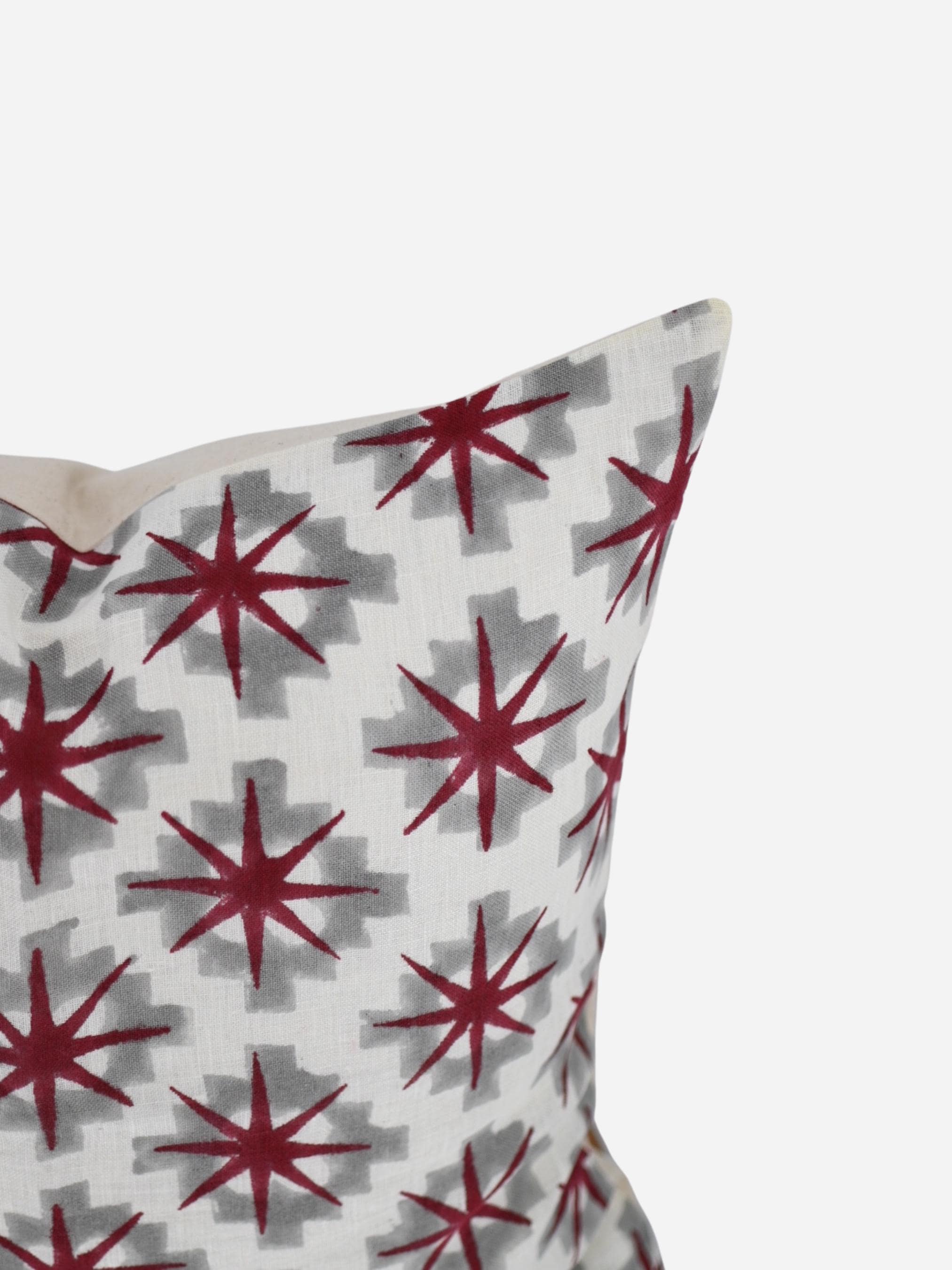 Close-up of the burgundy star medallion hand block print on linen