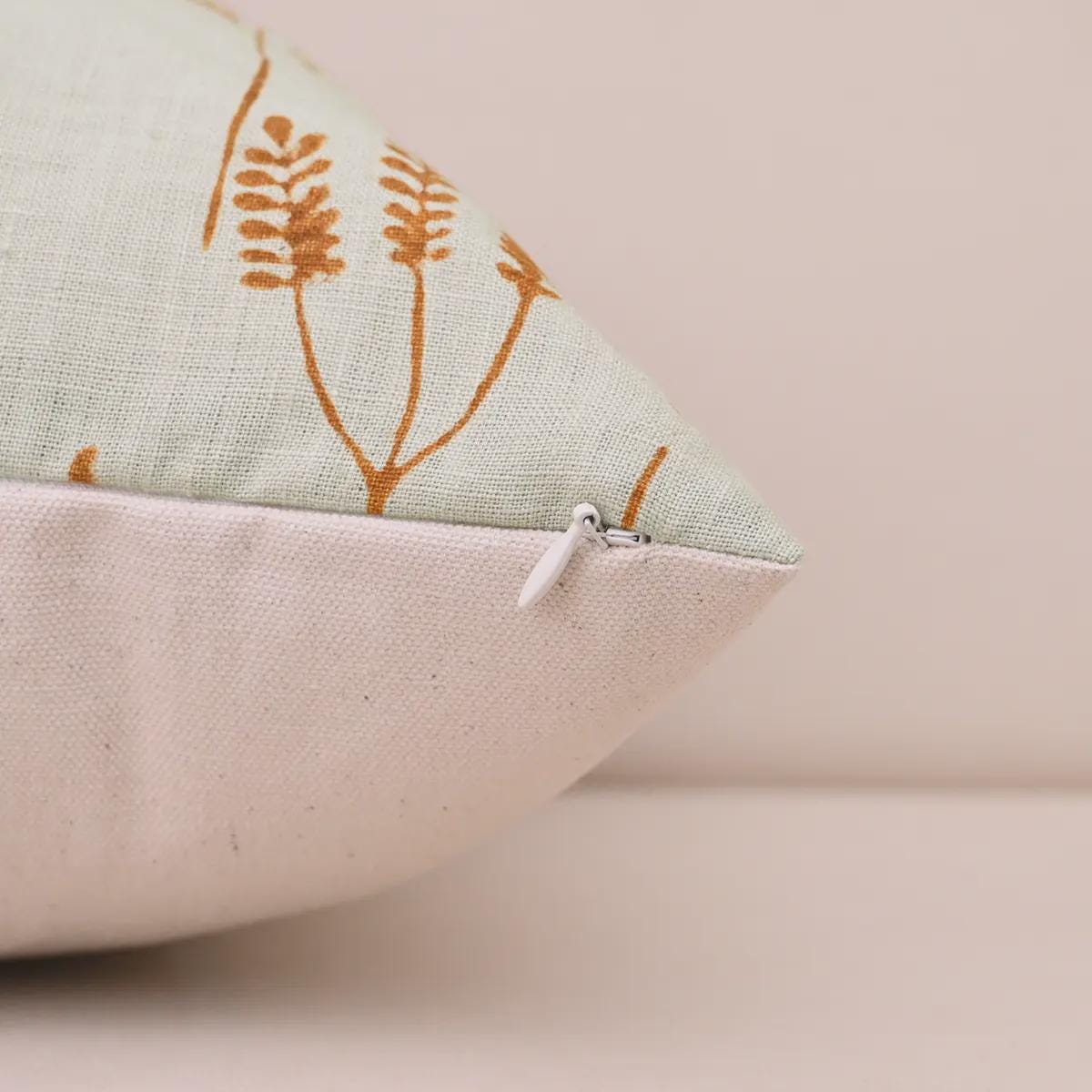 Rust botanical linen pillow cover corner and zipper detail