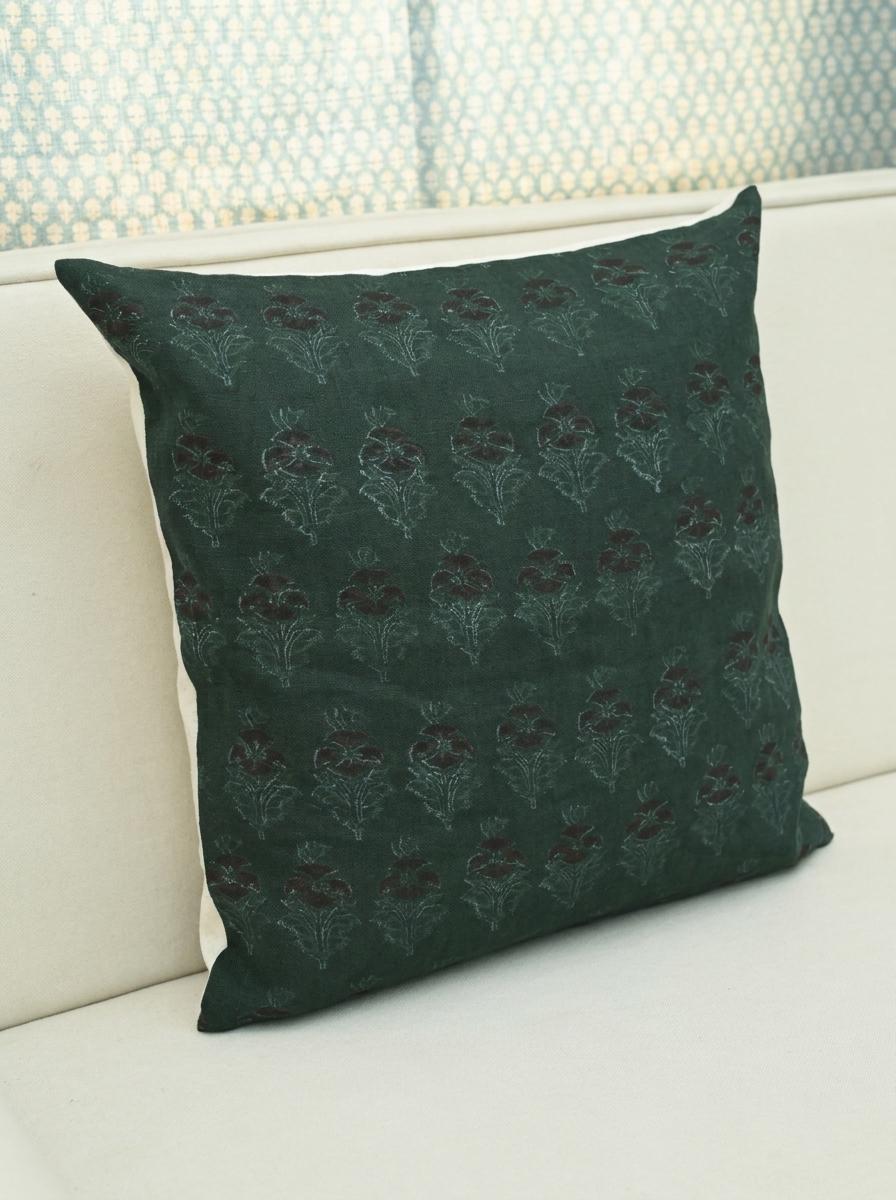 Forest green chintz bud pillow cover styled in a living room