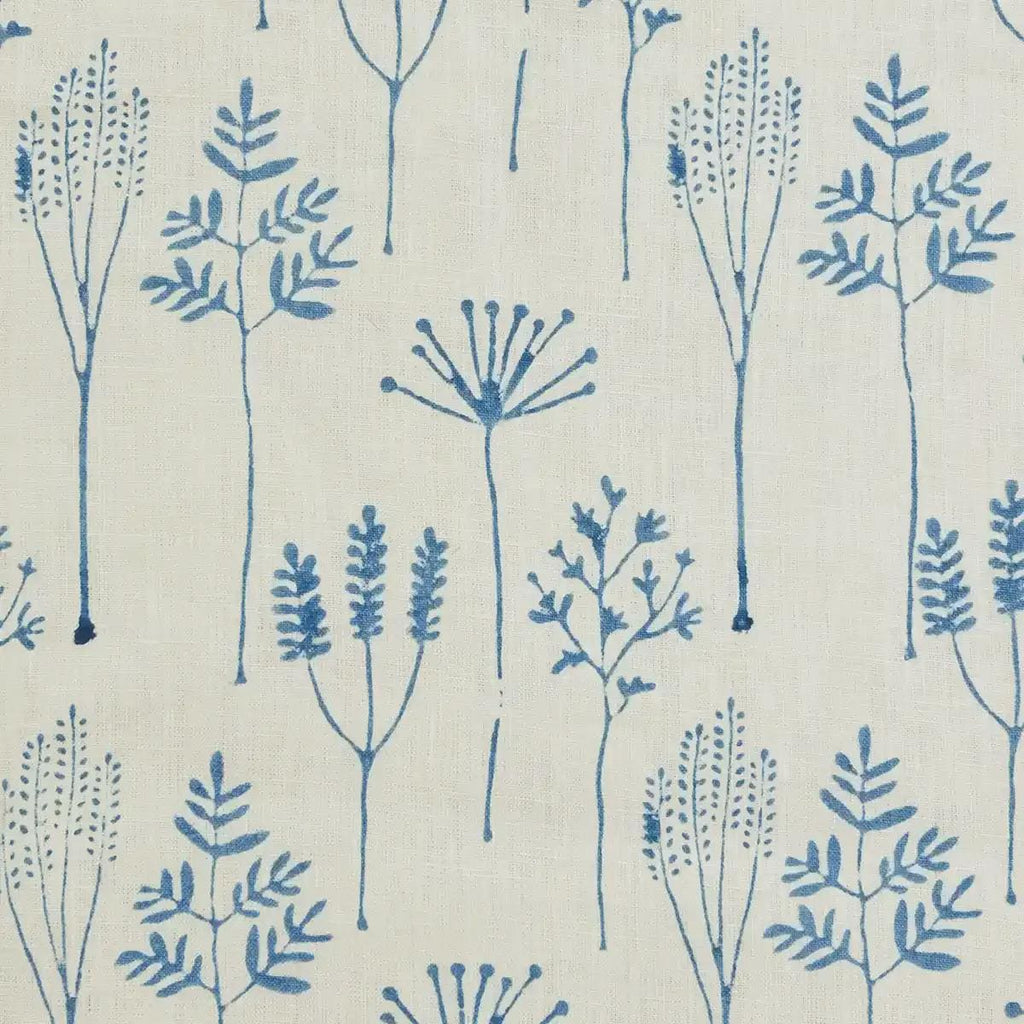 Close-up of blue botanical line-art block print on cream linen pillow cover