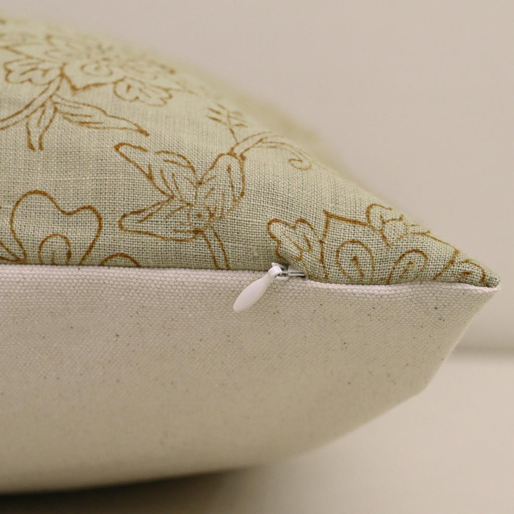 Close-up of hand block printed chintz jaal vine pattern on sage linen