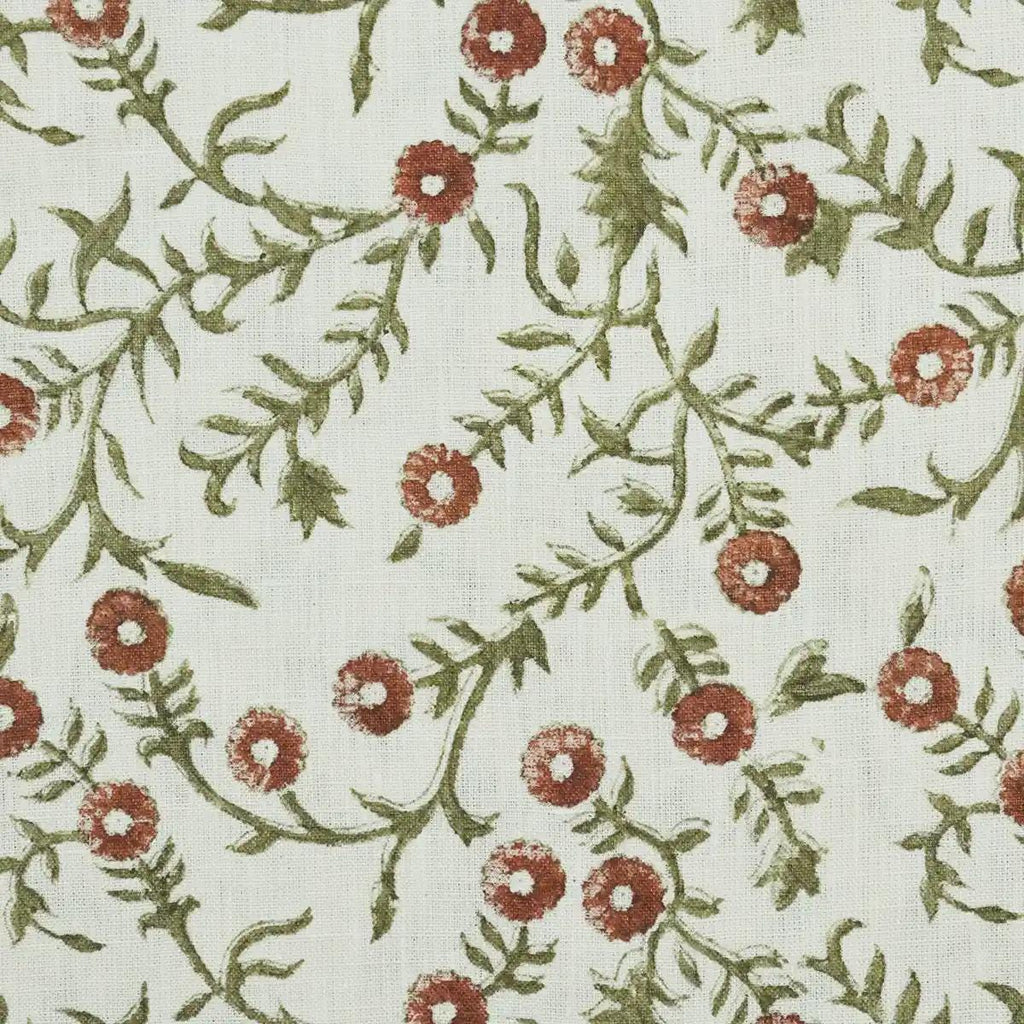 Terracotta floral block print linen cushion cover styled on a sofa