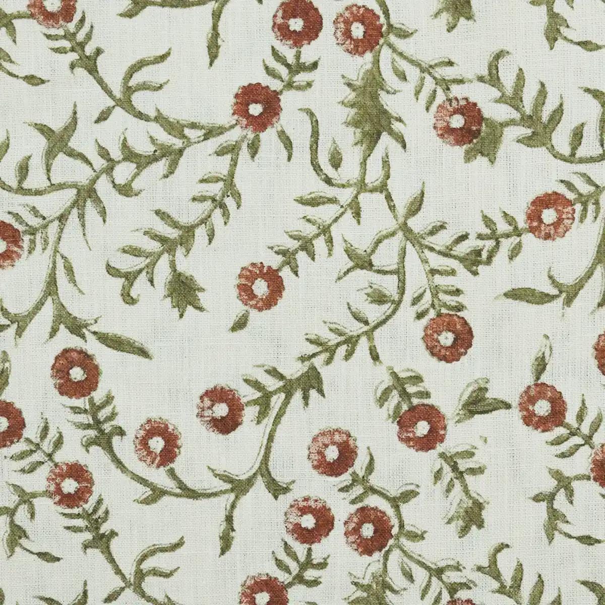 Terracotta floral block print linen cushion cover styled on a sofa