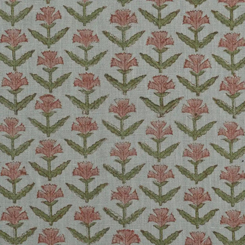 Rose pink buti block print linen pillow cover styled on a sofa