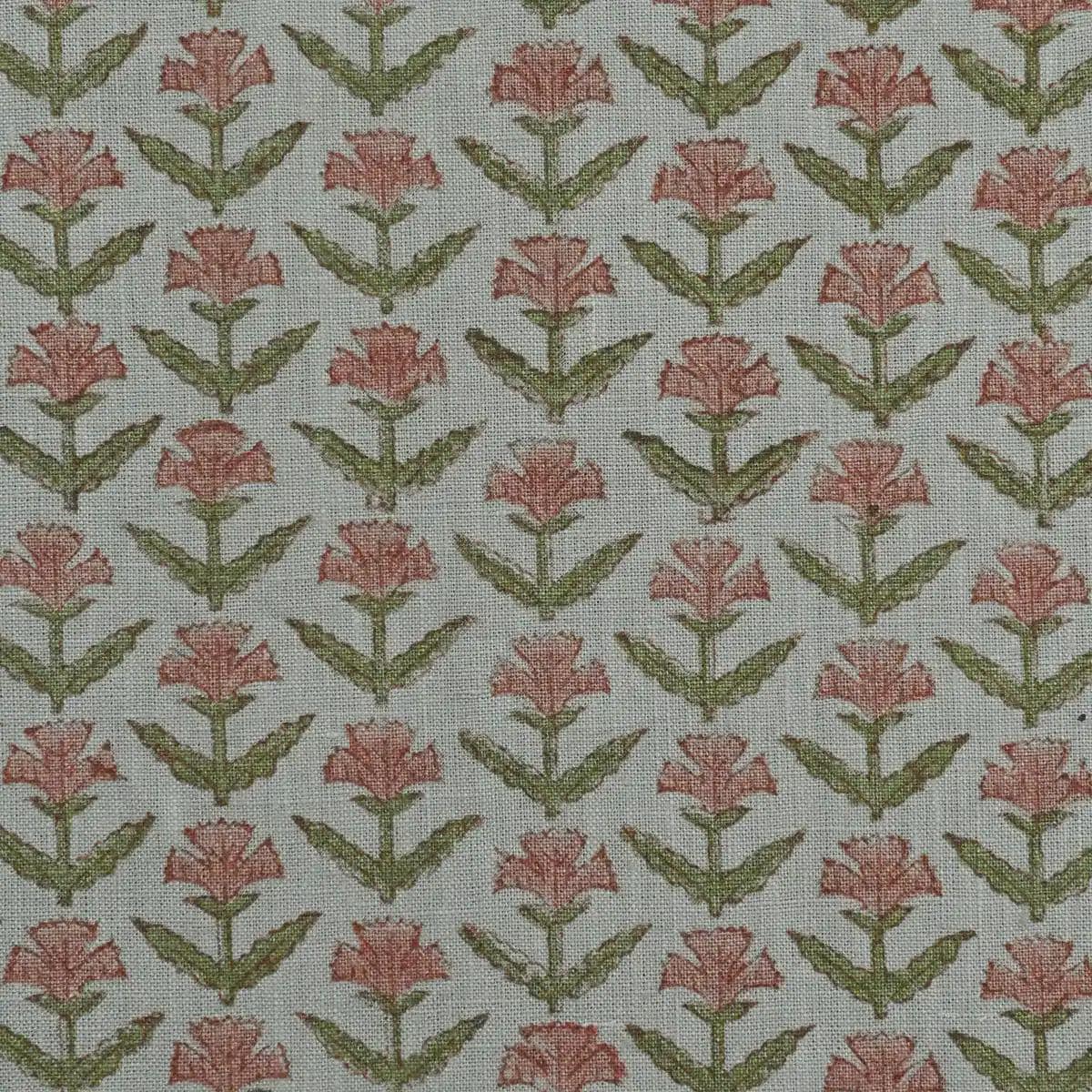 Rose pink buti block print linen pillow cover styled on a sofa