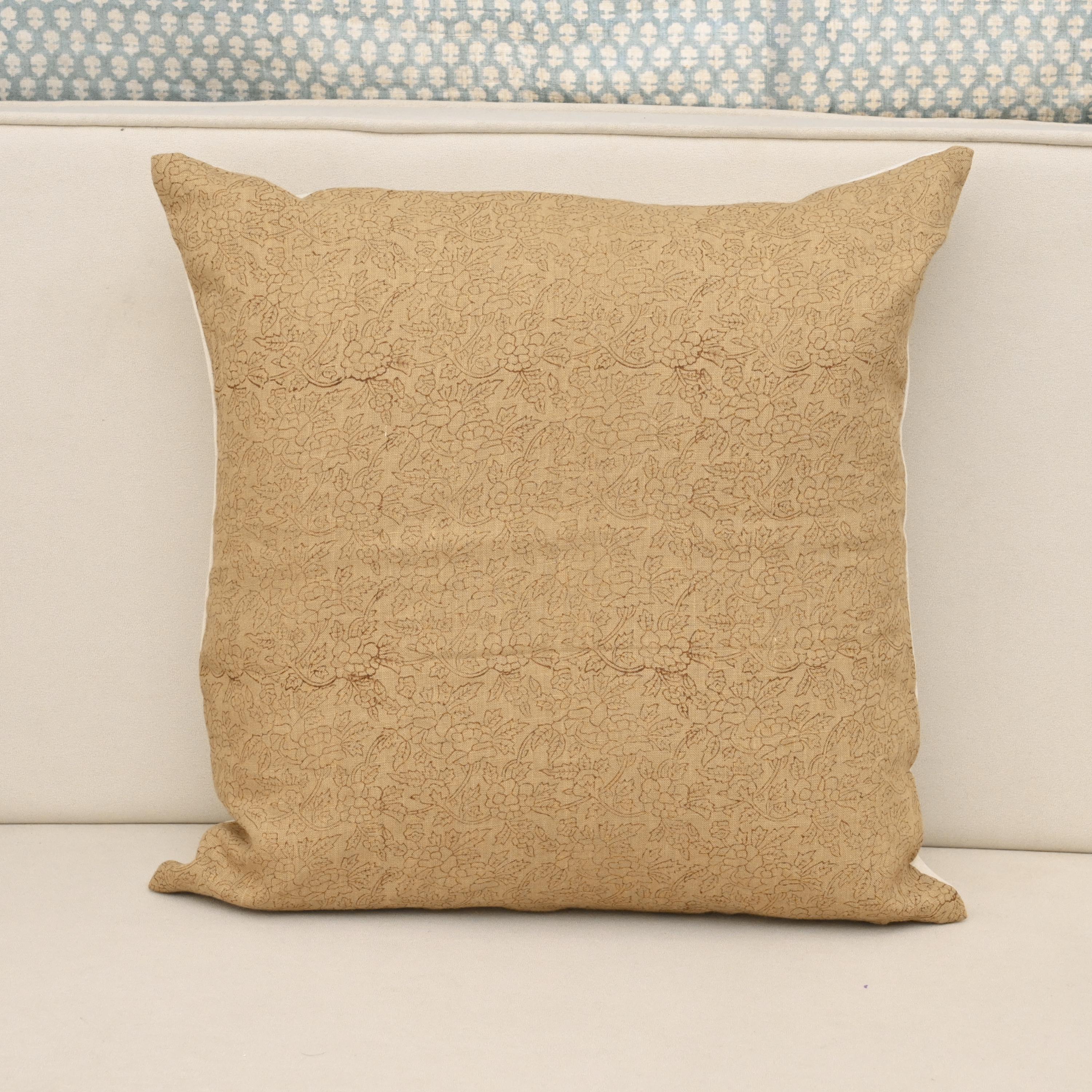 Mustard camel linen pillow cover with a fine hand block printed ditsy floral vine, front view