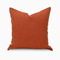 Burnt orange solid linen pillow cover, front view on white background