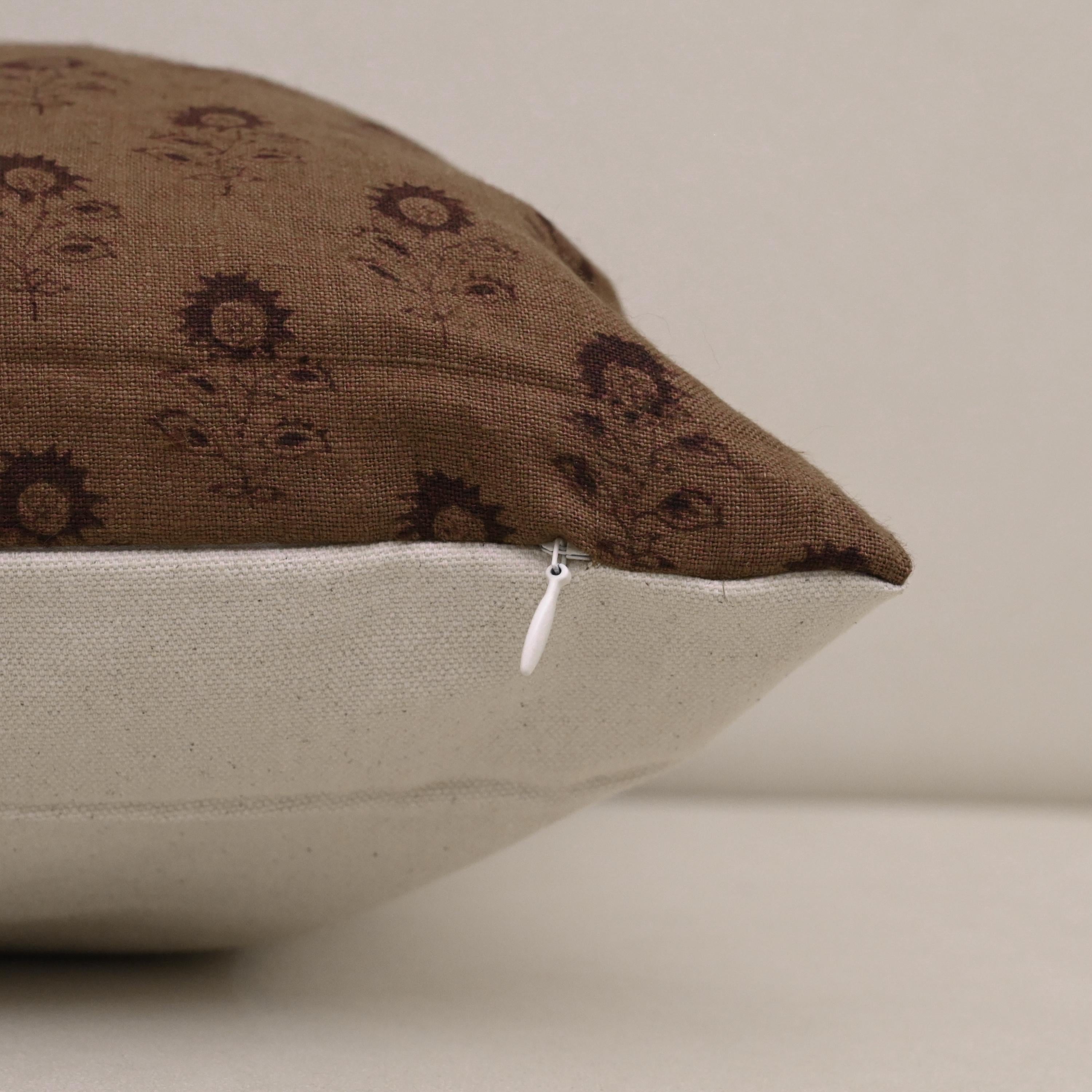 Close-up of espresso brown floral buti block print on linen fabric