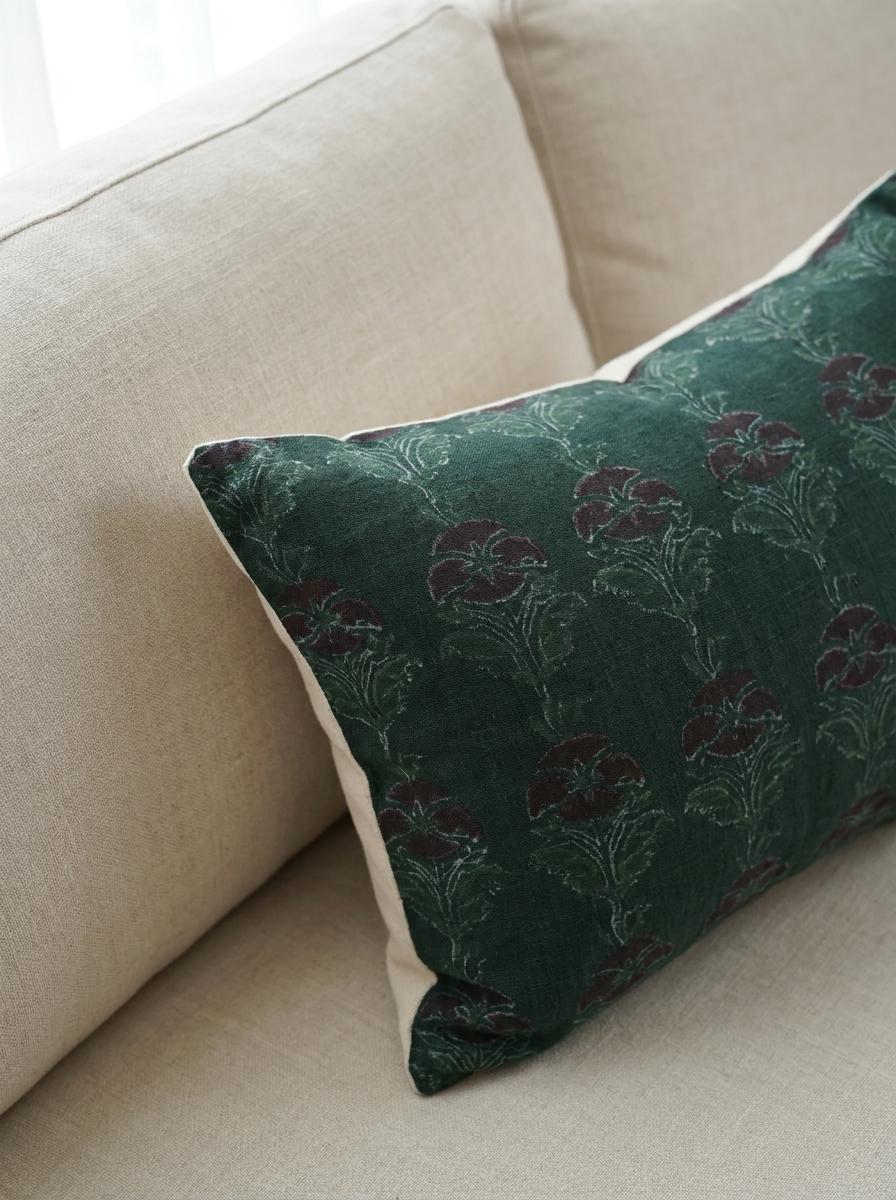 Fabric texture close-up of hand block printed forest green linen