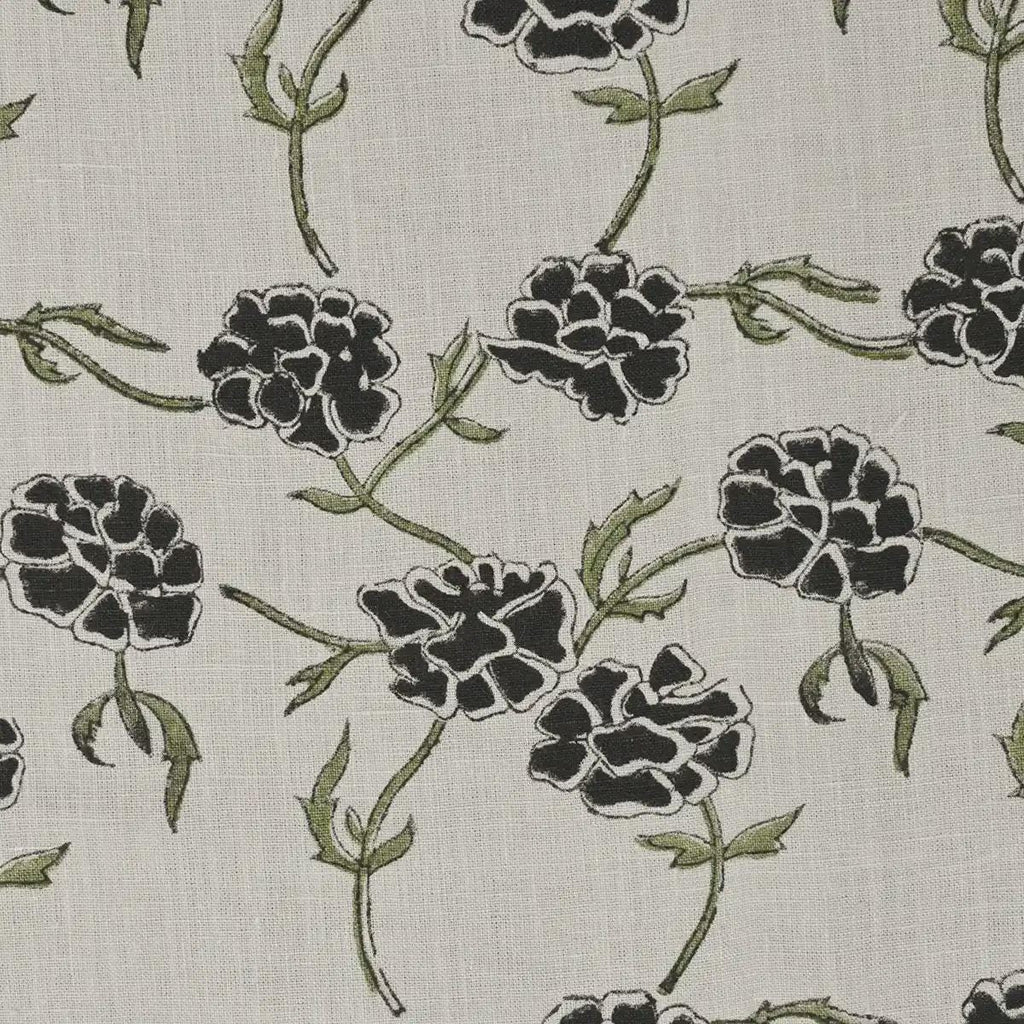 Close-up of charcoal floral block print detail on cream linen pillow cover