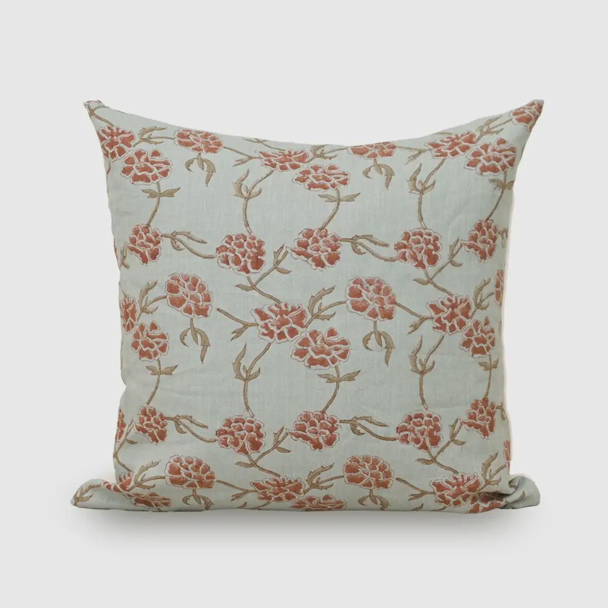Rust terracotta botanical hand block print linen cushion cover on dusty blue background
