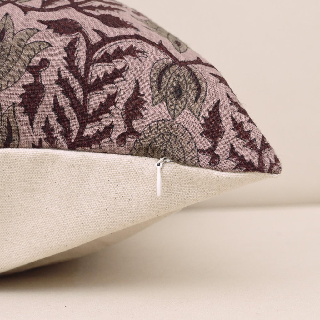 Corner and hidden zipper detail on mauve damask linen pillow cover