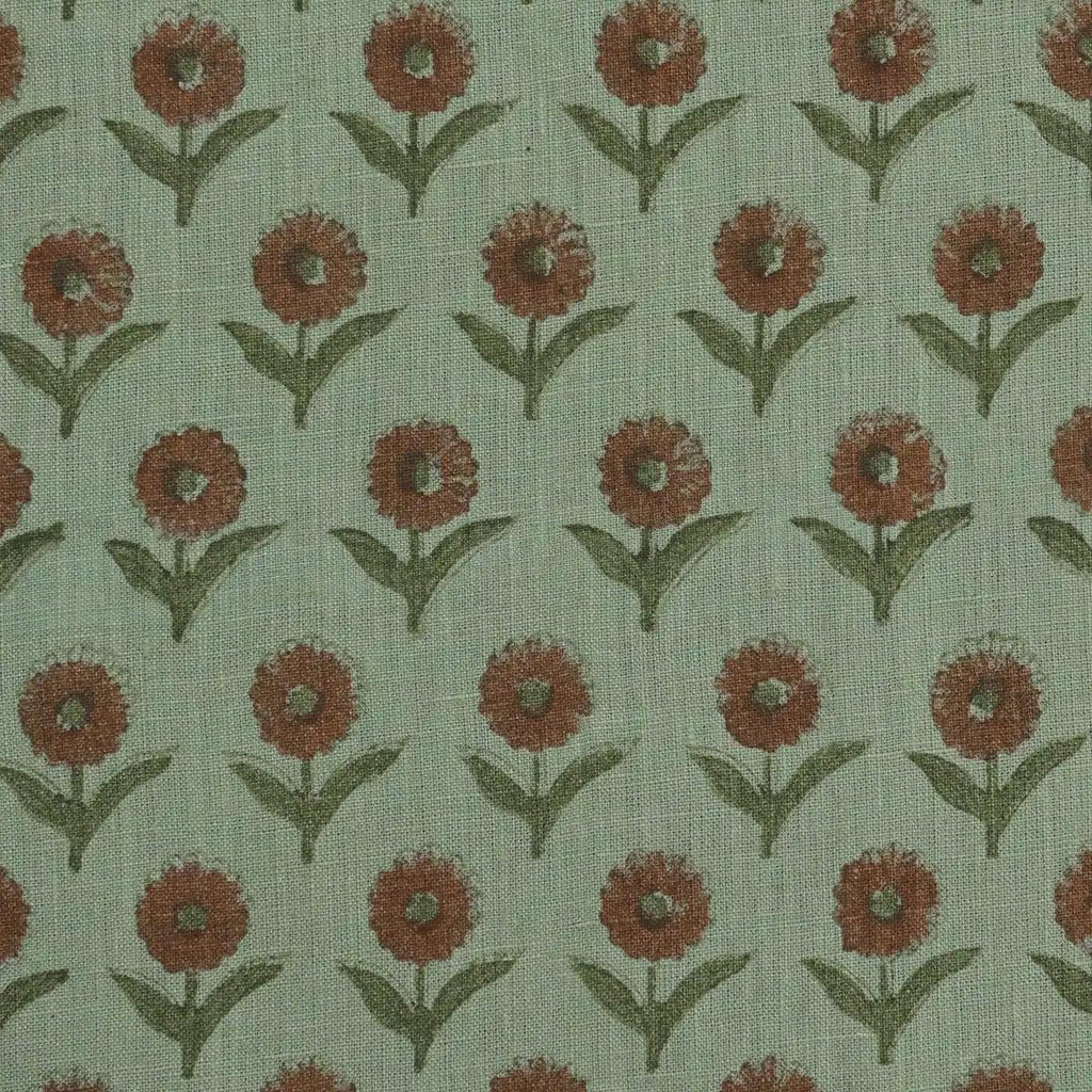 Sage green block print linen pillow cover styled on a sofa