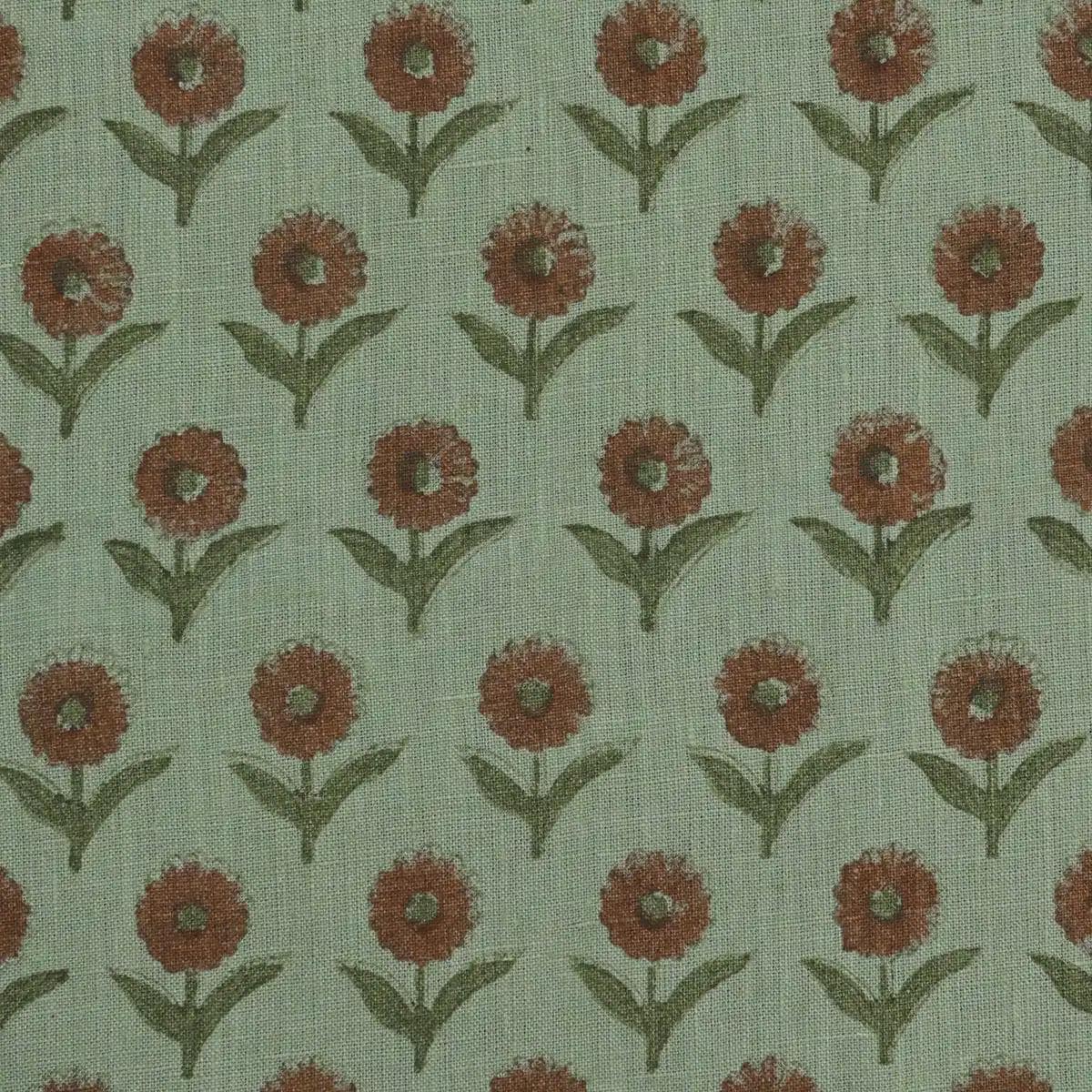 Sage green block print linen pillow cover styled on a sofa