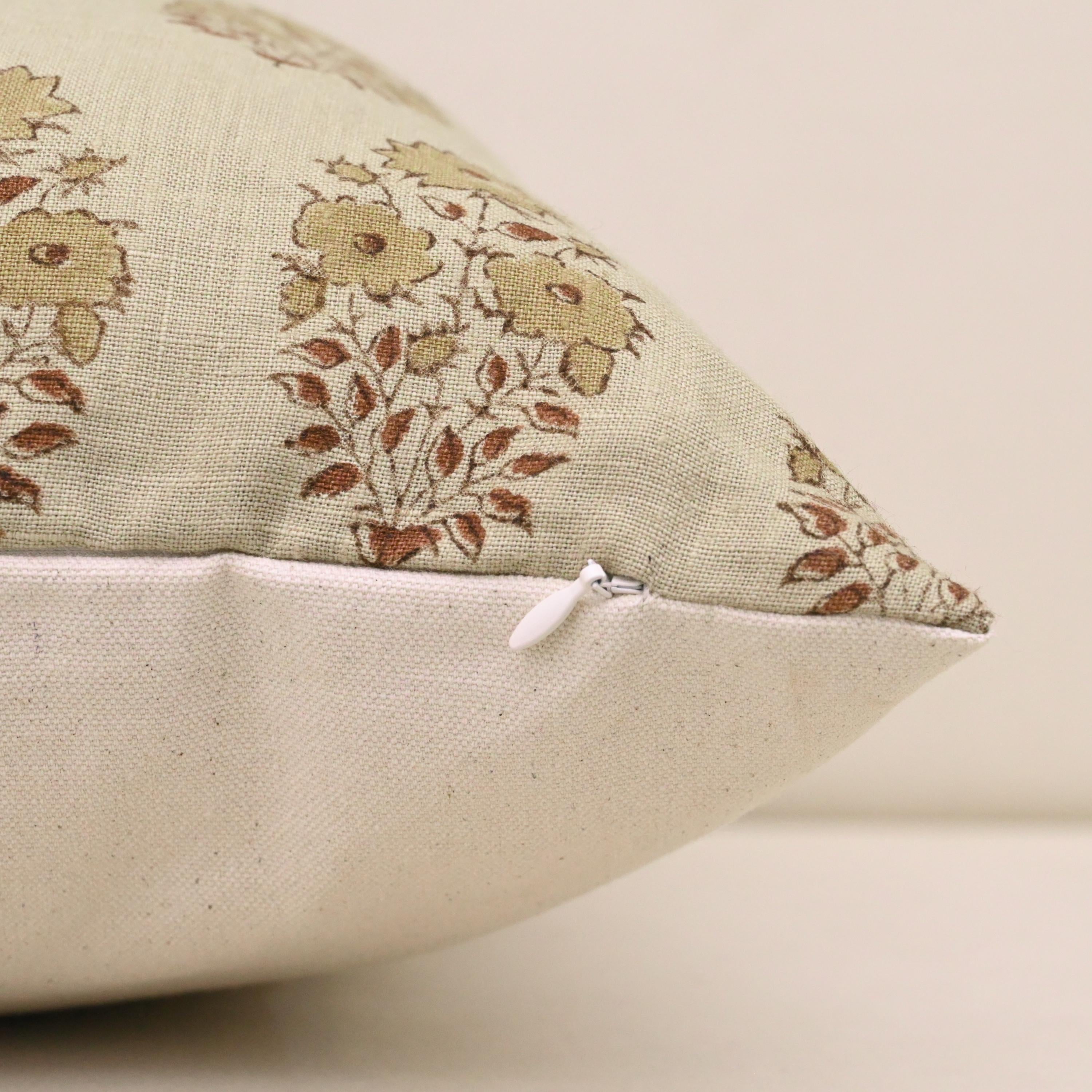 Close-up of buta floral block print detail on ivory linen cushion cover