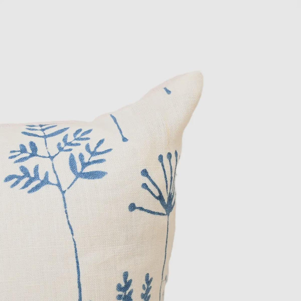 Hidden zipper and corner detail of blue botanical linen pillow cover