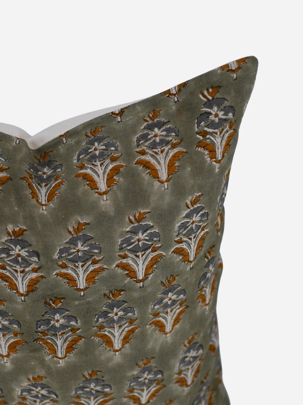 Close-up of the sage green floral buti hand block print on linen