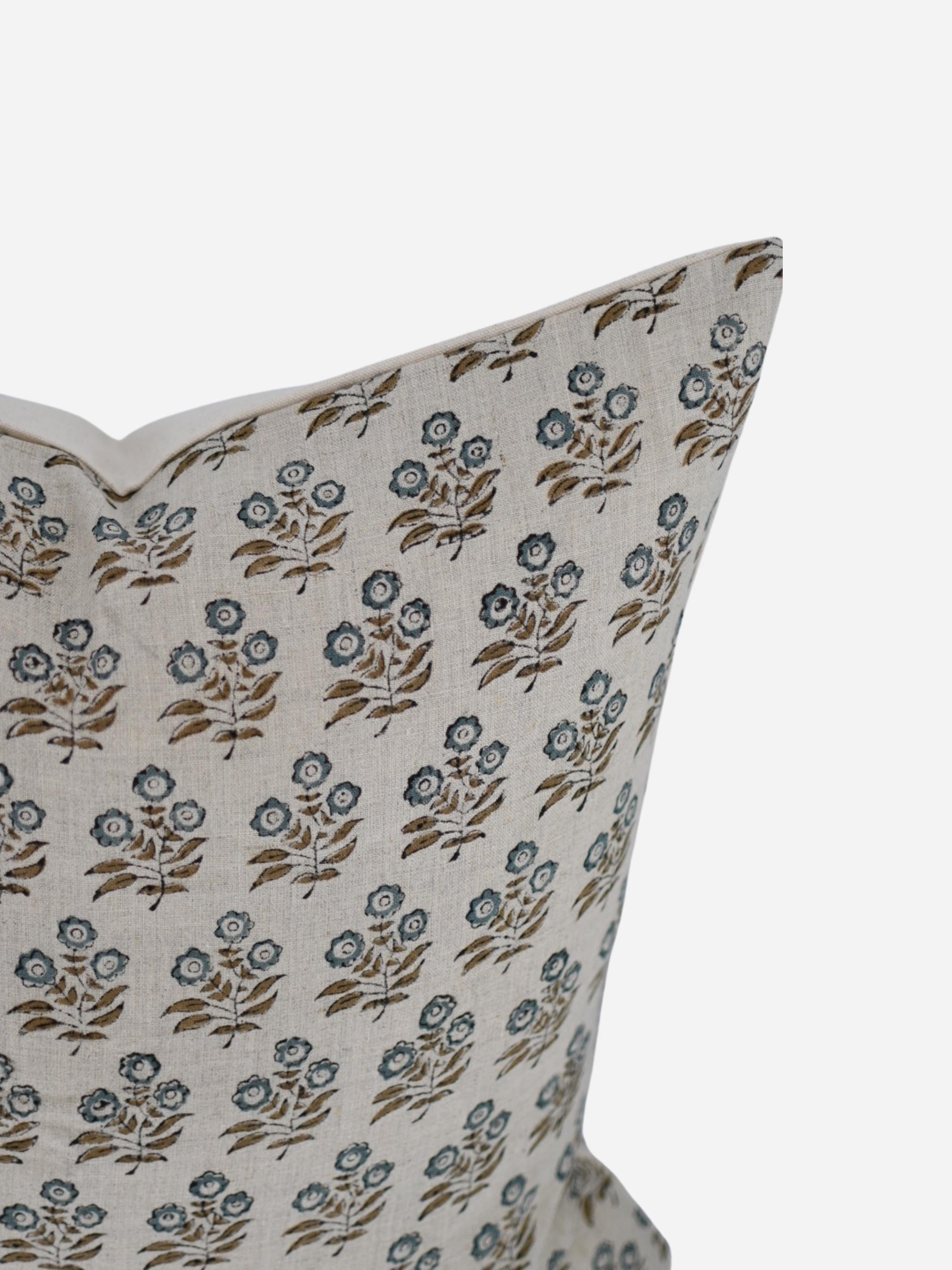 Close-up of the blue-grey floral sprig hand block print on natural linen