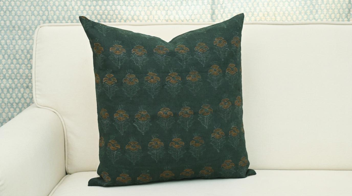 Fabric texture close-up of hand block printed forest green floral linen