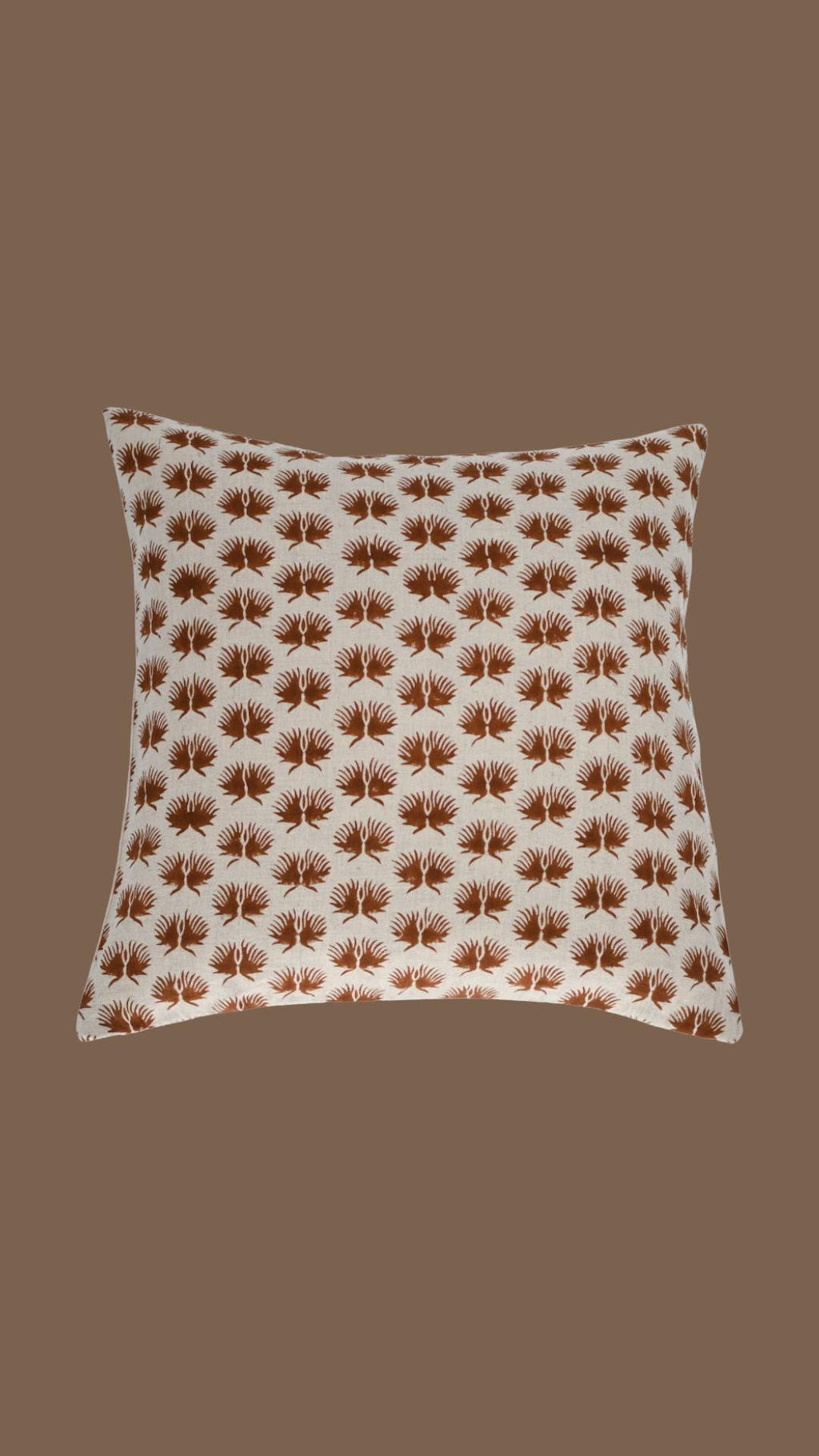 Close-up of the rust fern hand block print on natural linen