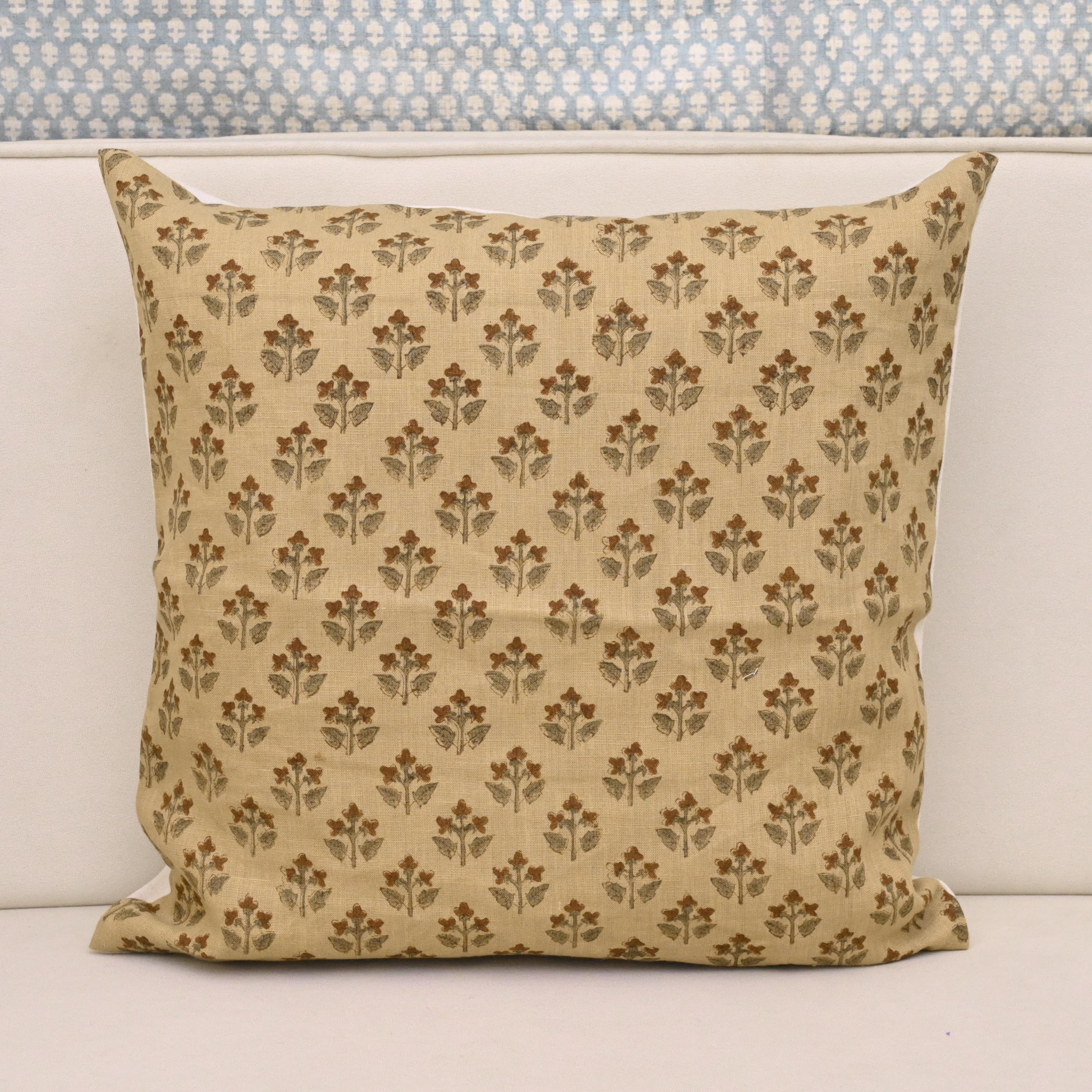 Camel linen pillow cover with hand block printed rust brown floral buti and sage leaves, front view
