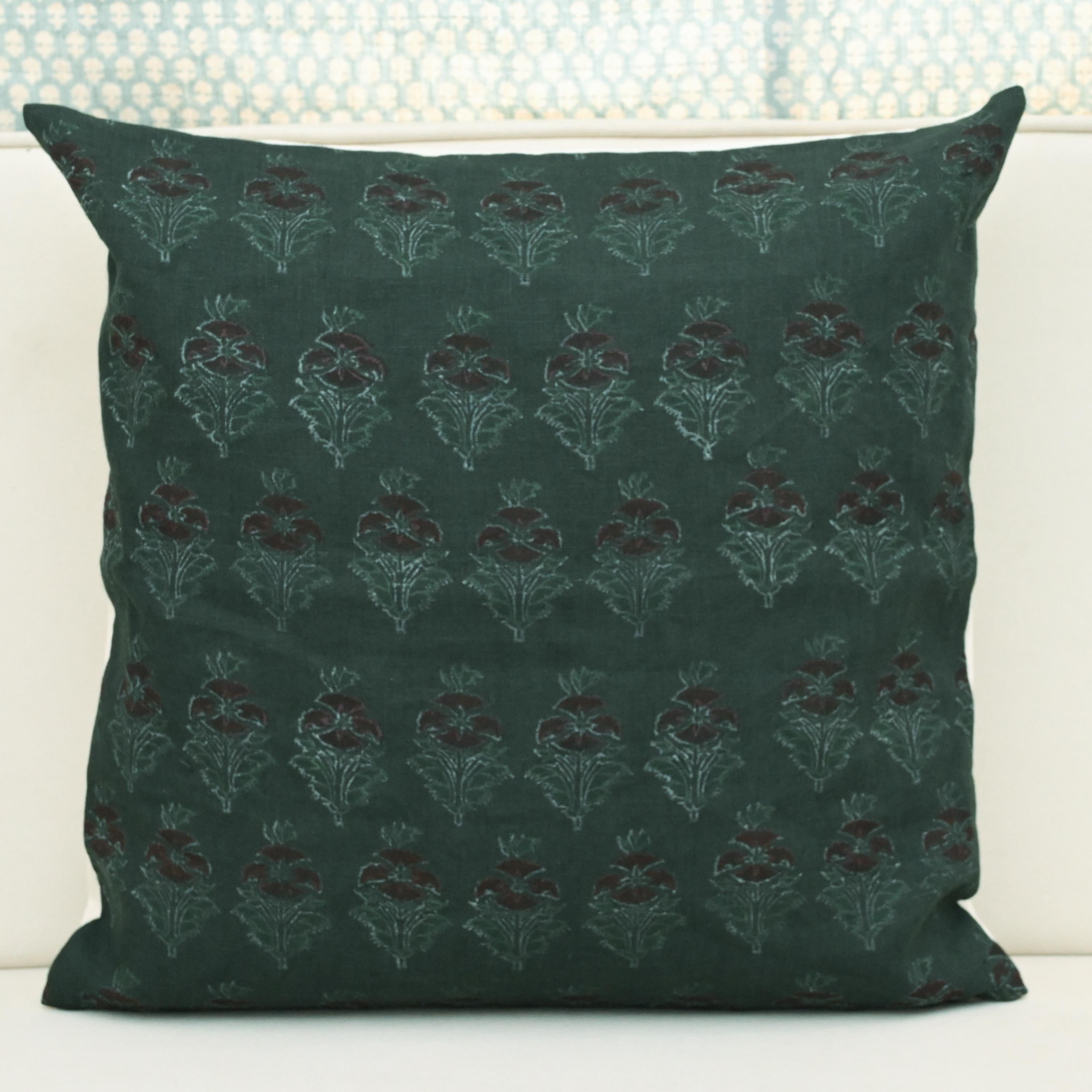Forest green chintz bud block print linen pillow cover styled on a sofa