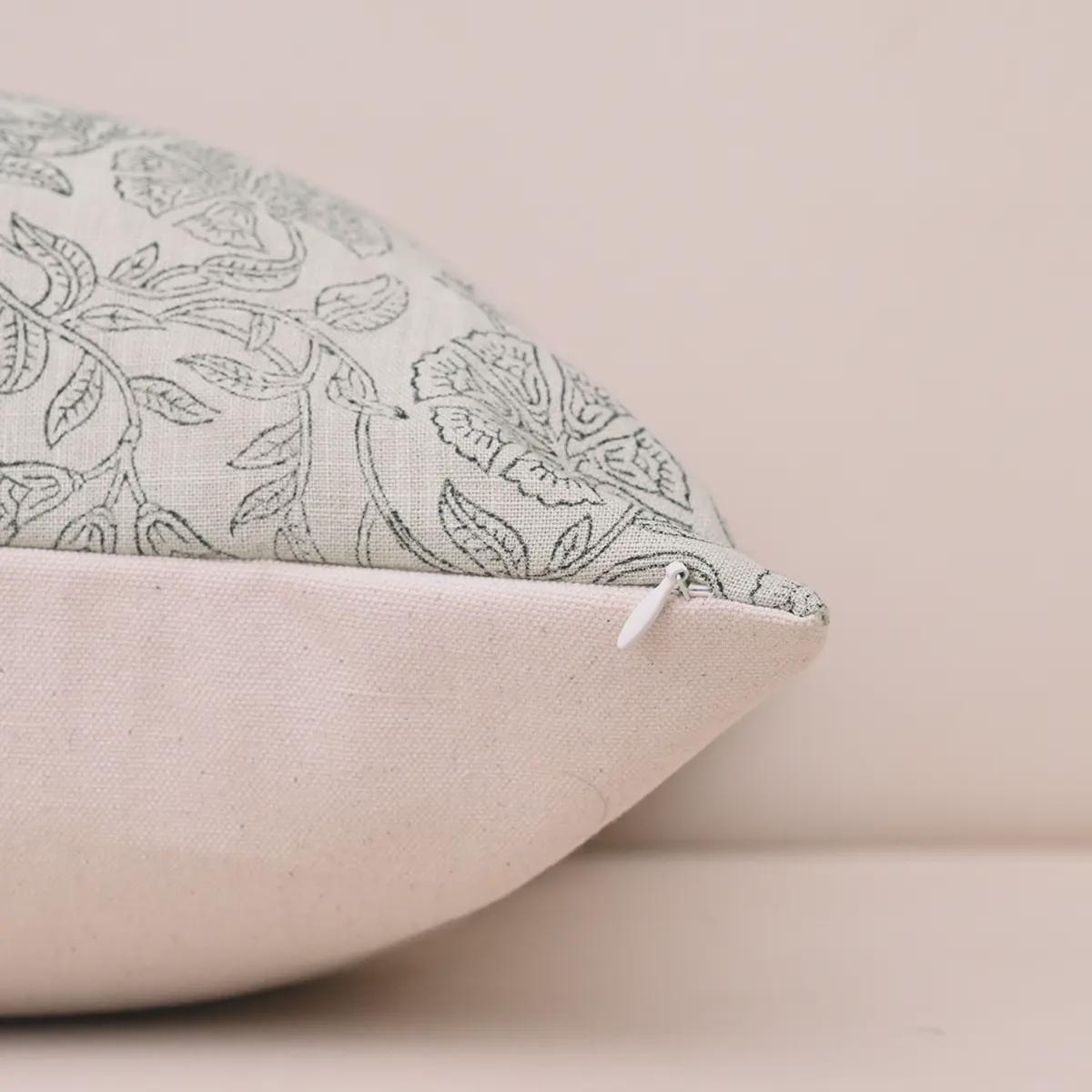 Hidden zipper and corner detail of ashen grey linen pillow cover