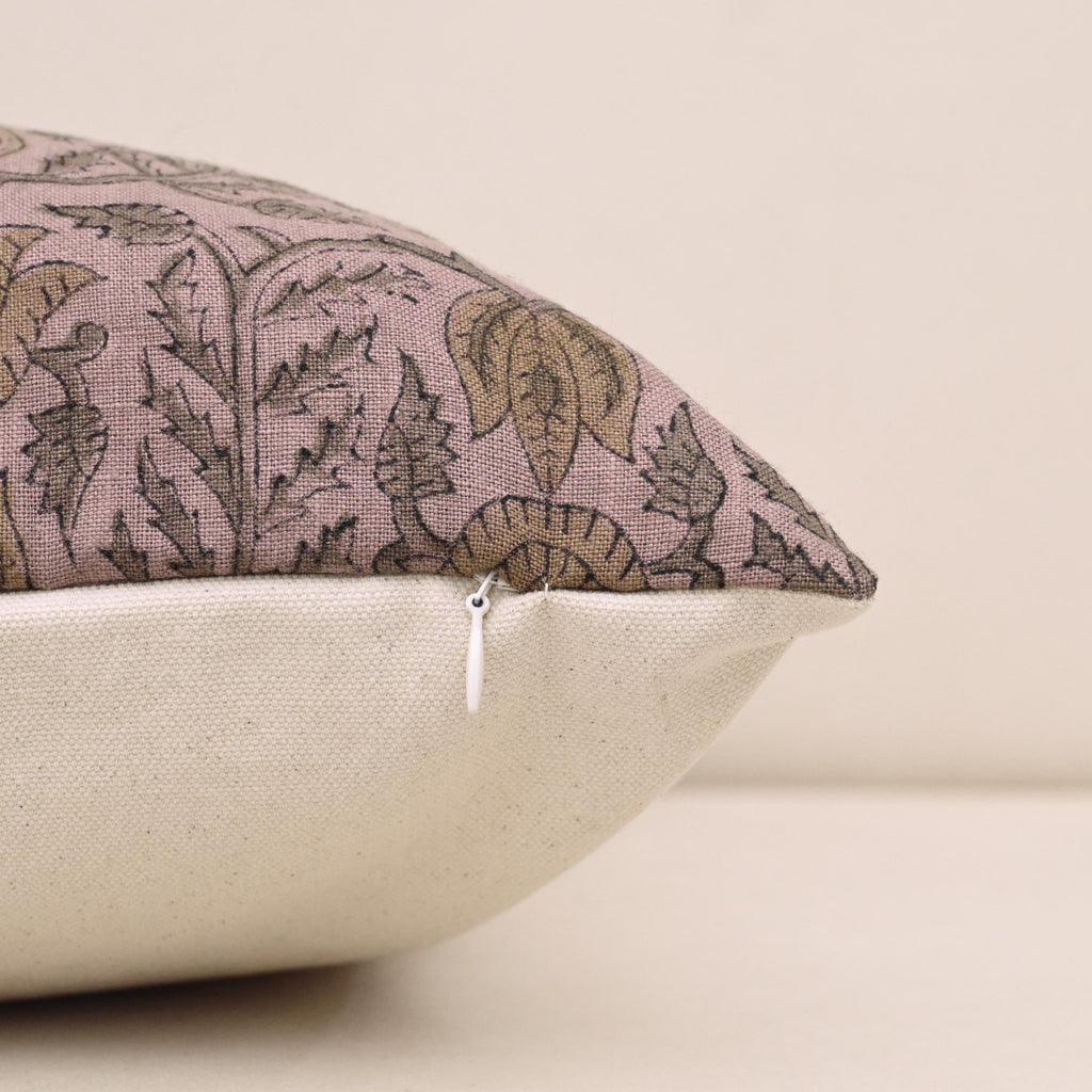 Corner and hidden zipper detail on mauve damask linen pillow cover