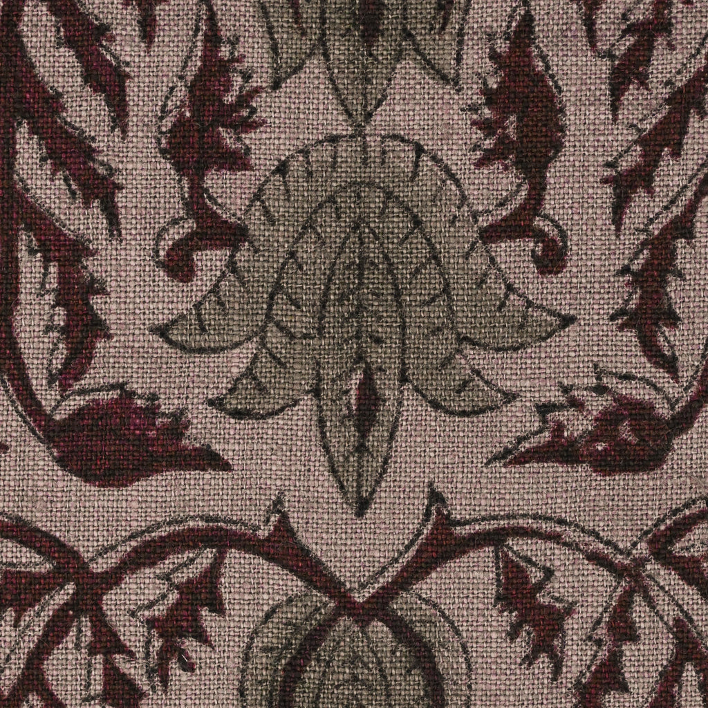Close-up of the damask lotus vine block print in wine and sage on mauve linen