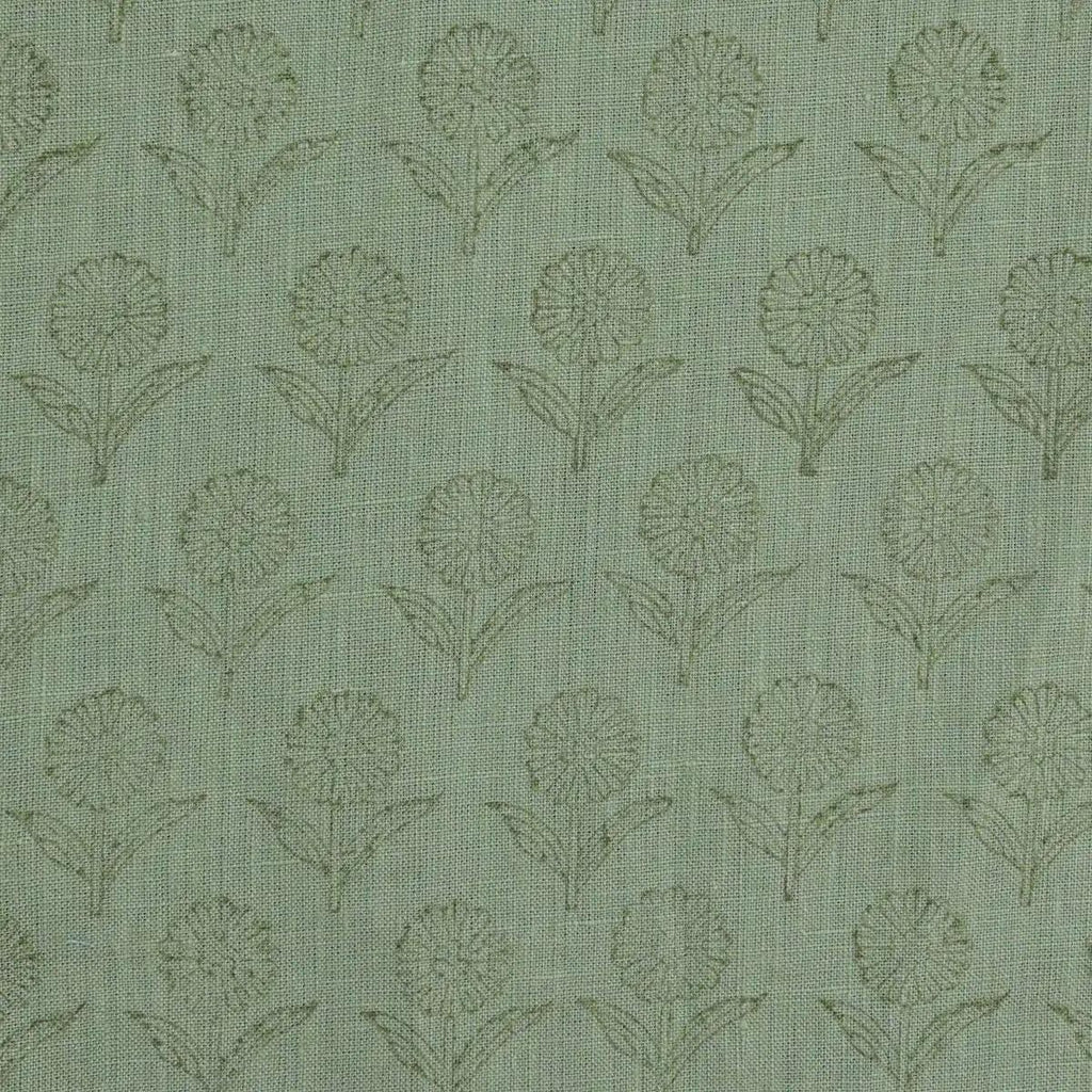 Sage green block print linen pillow cover styled on a sofa