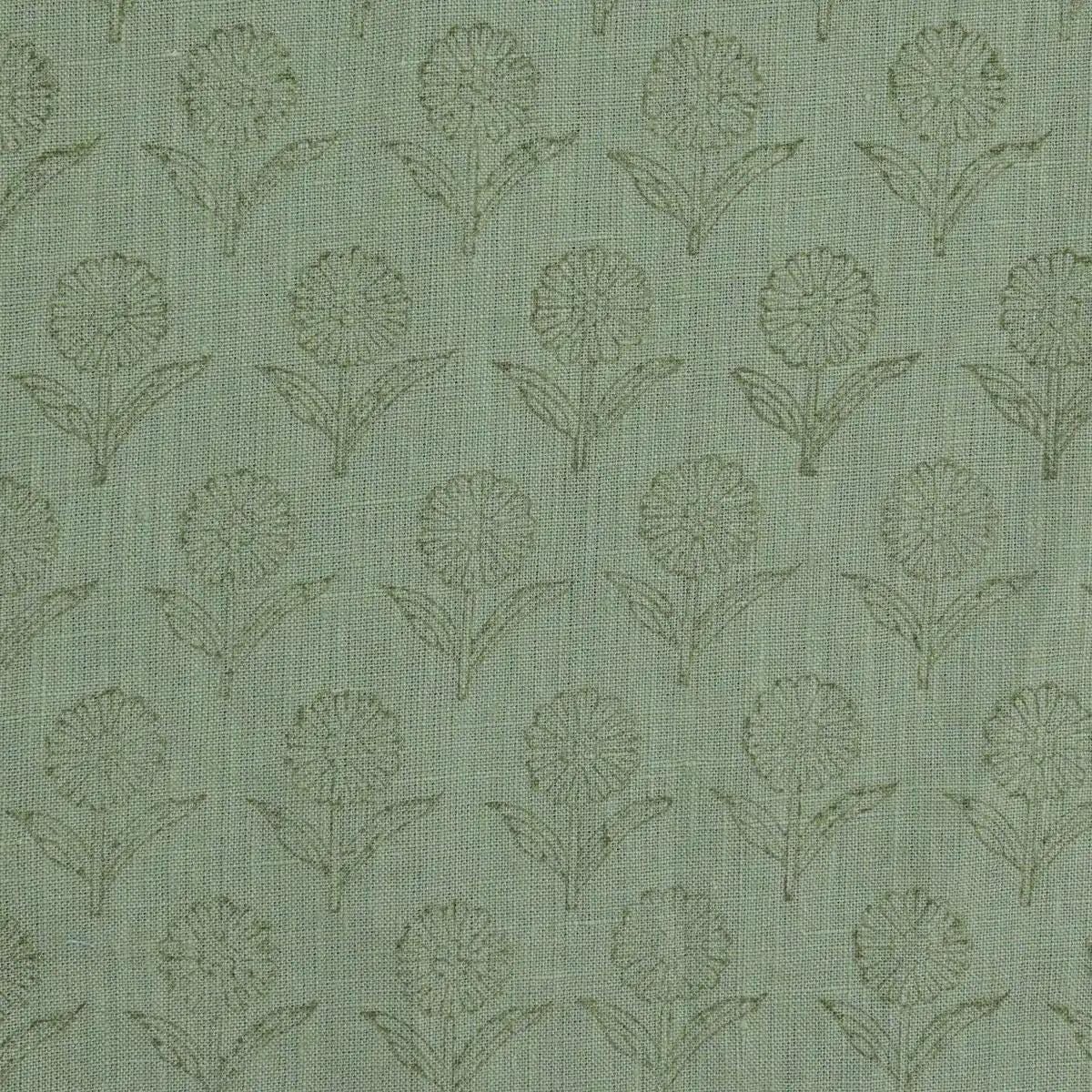 Sage green block print linen pillow cover styled on a sofa