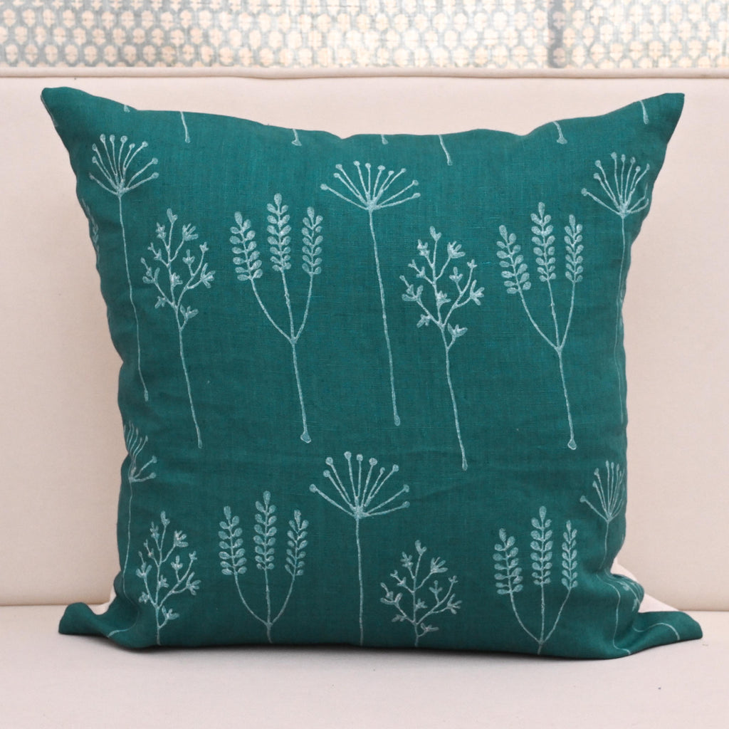 Teal wild meadow block print linen pillow cover styled on a sofa