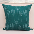 Teal wild meadow block print linen pillow cover styled on a sofa