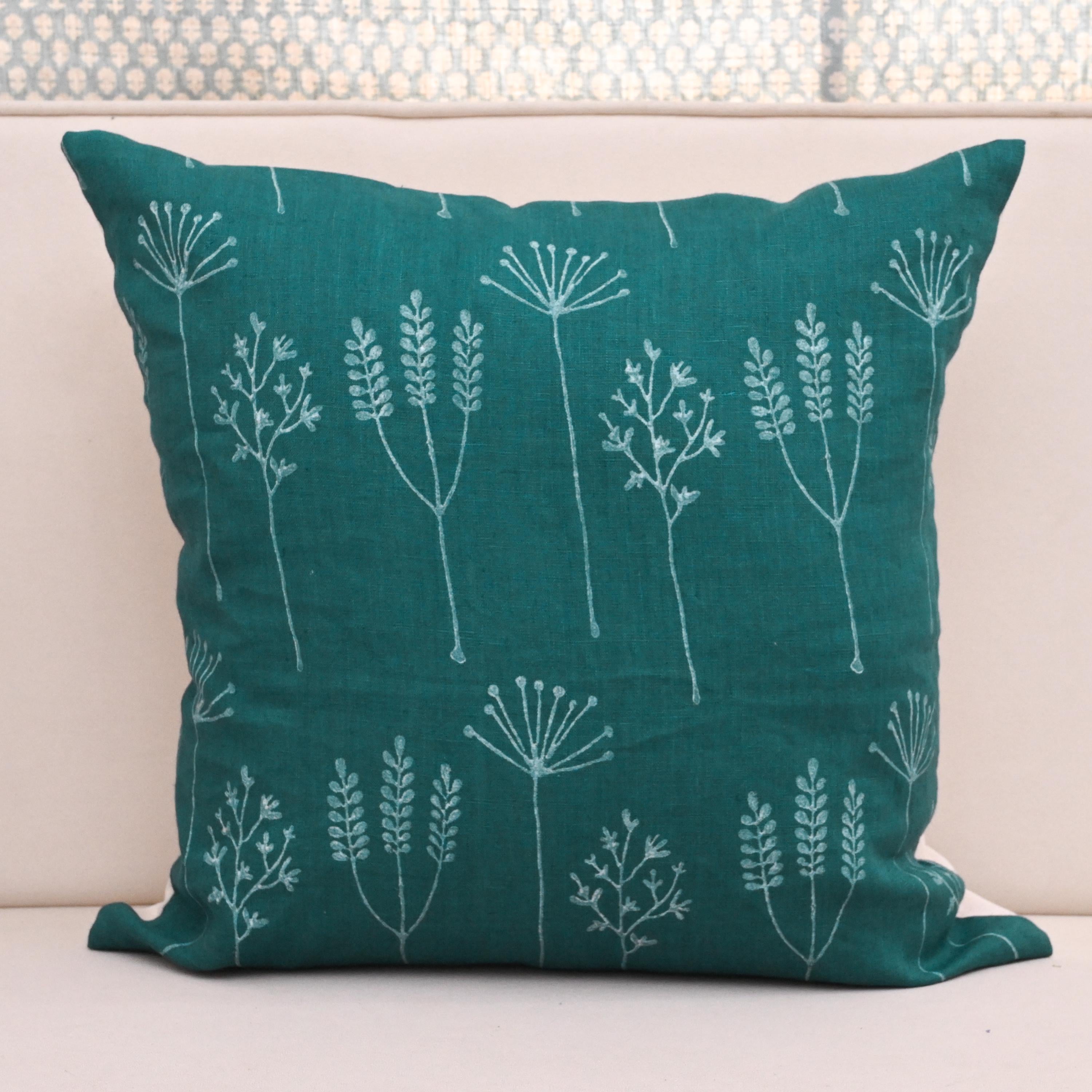 Teal wild meadow block print linen pillow cover styled on a sofa