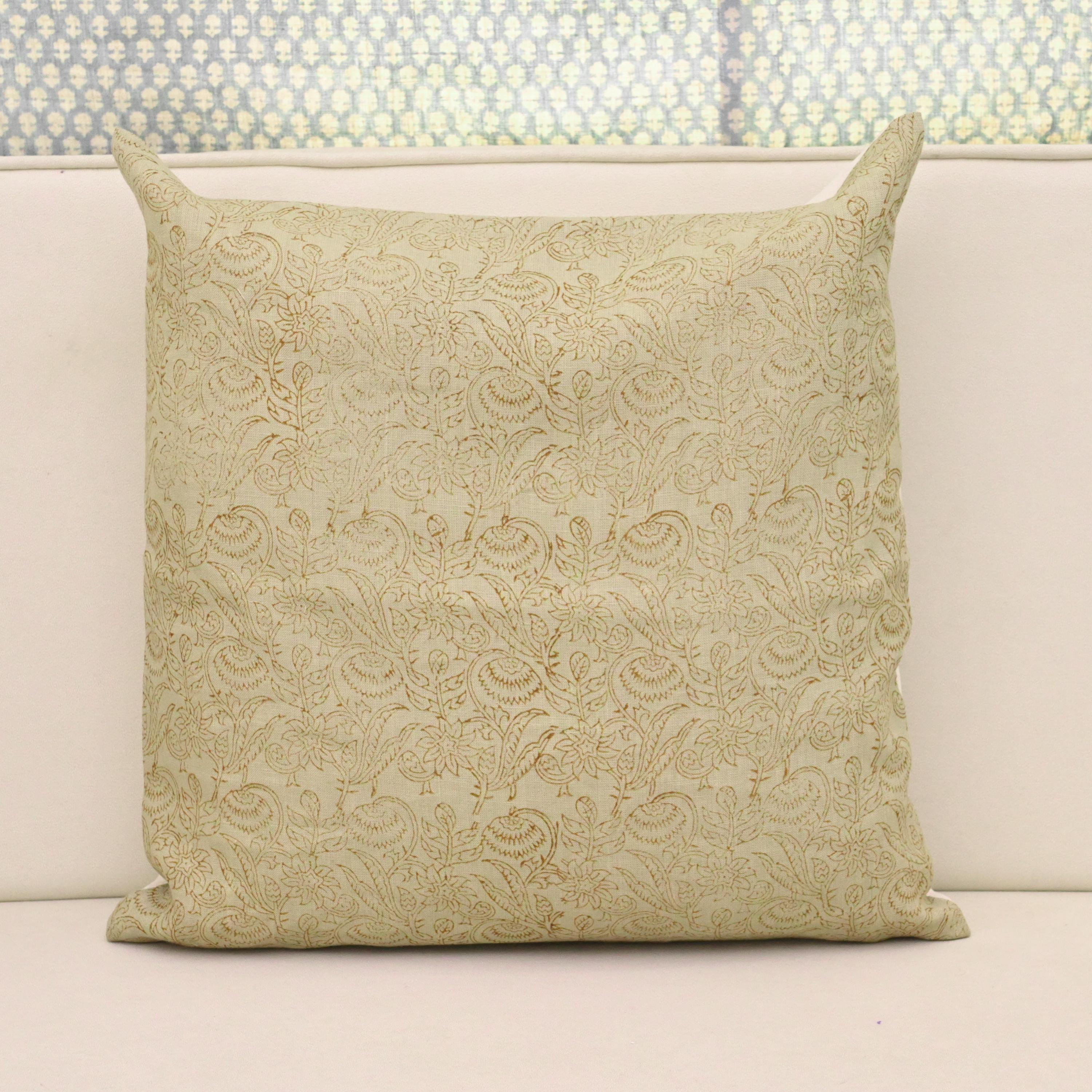 Sage green chintz vine block print linen pillow cover styled on a sofa