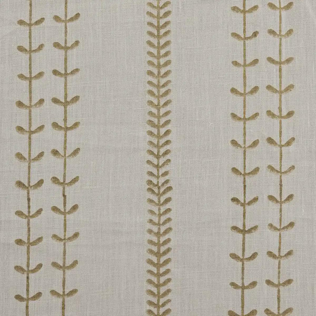 Olive leaf trail block print linen pillow cover styled on a sofa