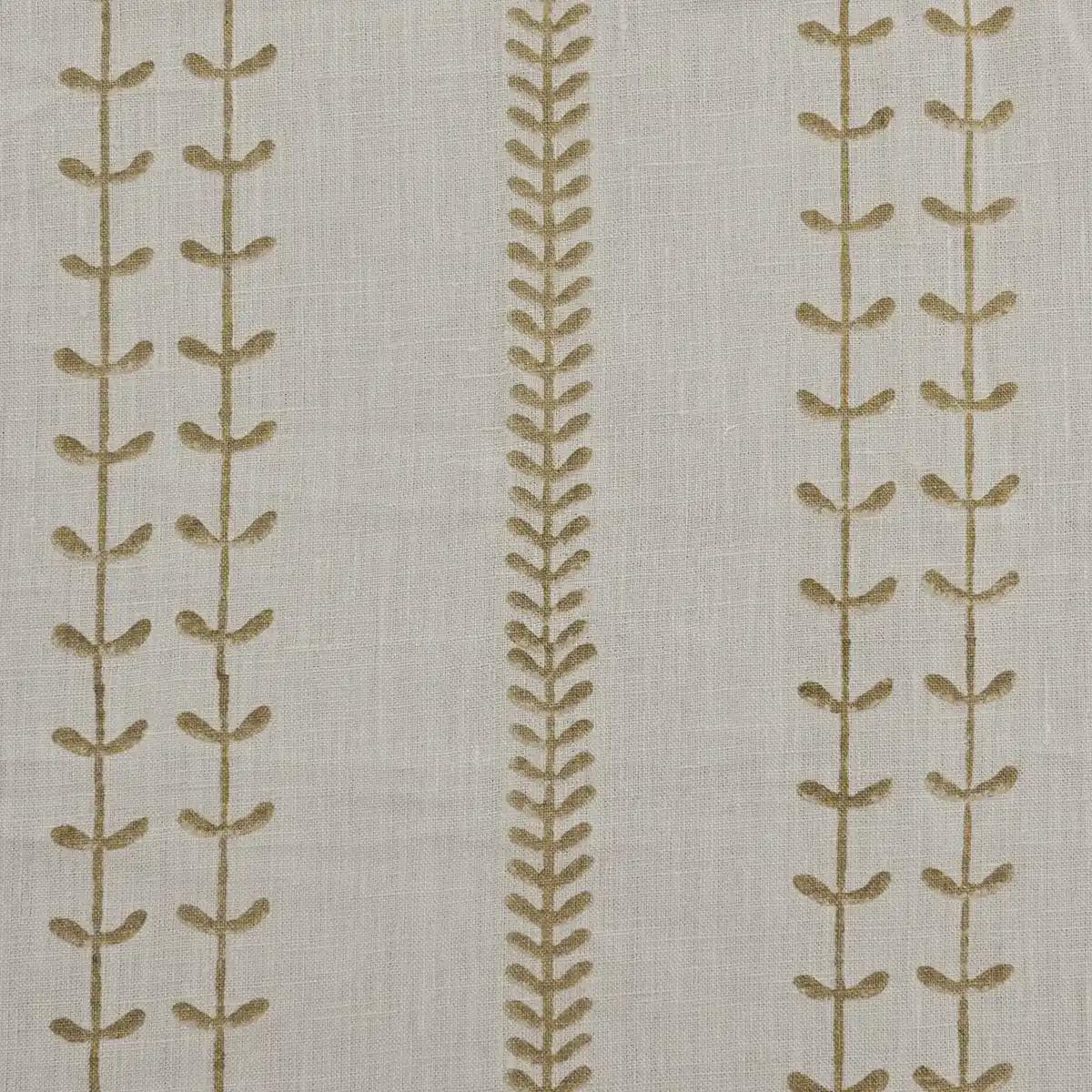 Olive leaf trail block print linen pillow cover styled on a sofa