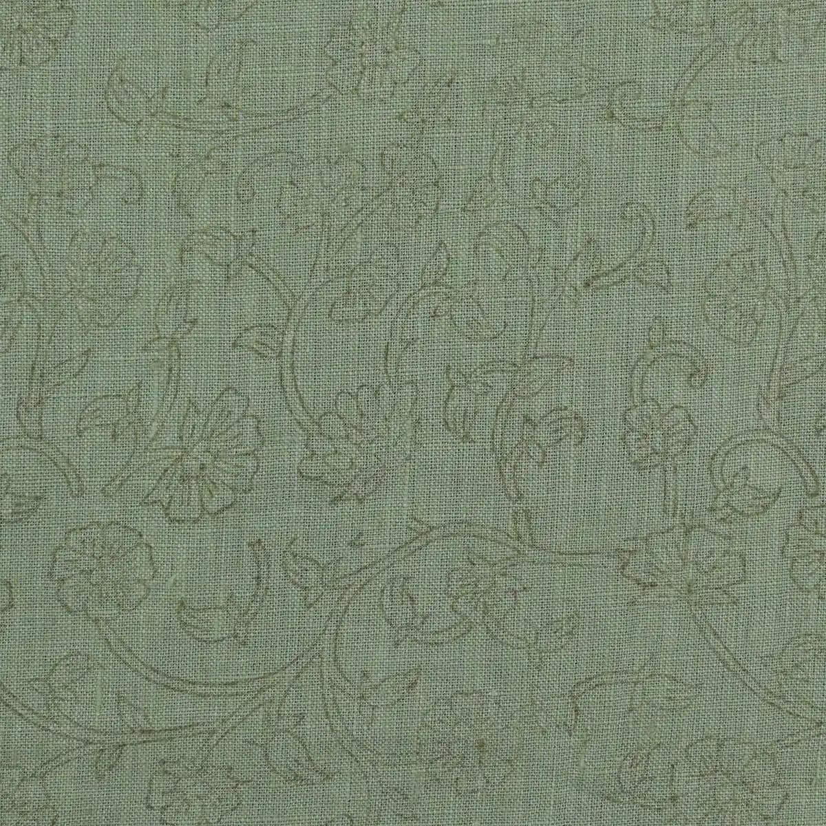 Sage green botanical block print linen pillow cover styled on a sofa