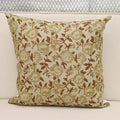 Sage green and rust brown hand block print linen pillow cover on ivory background