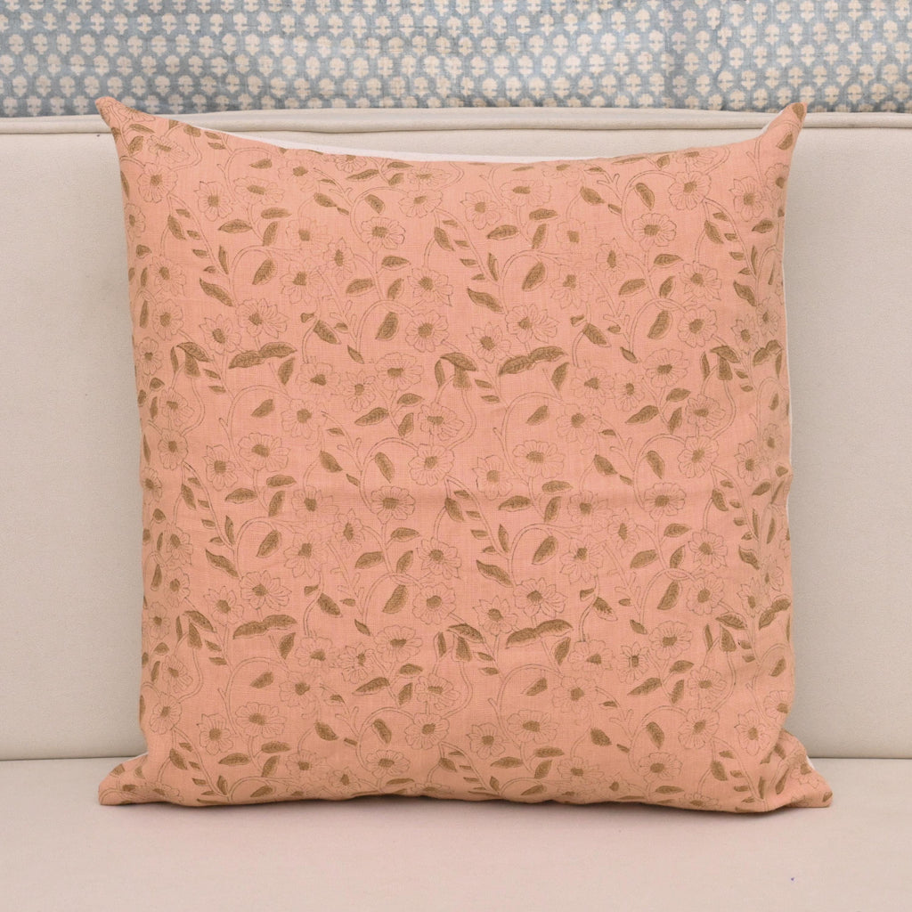 Golden floral hand block print linen pillow cover on blush pink background