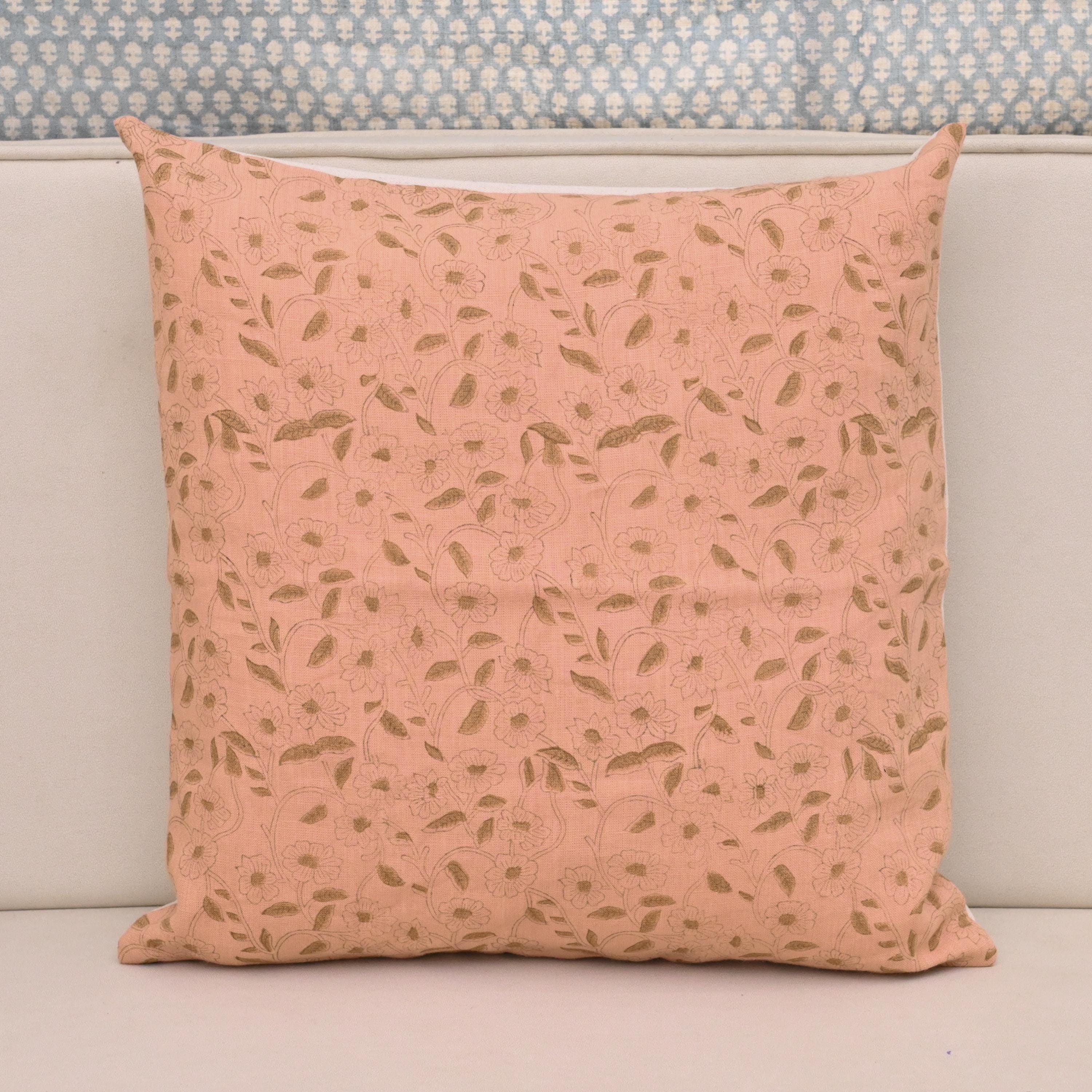 Golden floral hand block print linen pillow cover on blush pink background